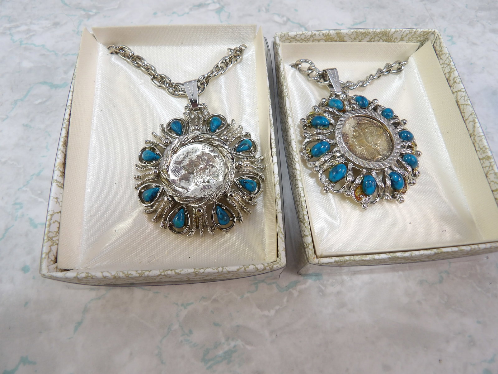 Pair of Southwest Style Silver Tone and Turquoise Pendant Necklaces: Pair of Vintage Southwestern Style Silver Tone Turquoise Pendant Necklaces with Mercury Dime. All measurements approximate. Please see photos for condition and details. Selling as is from 04281.