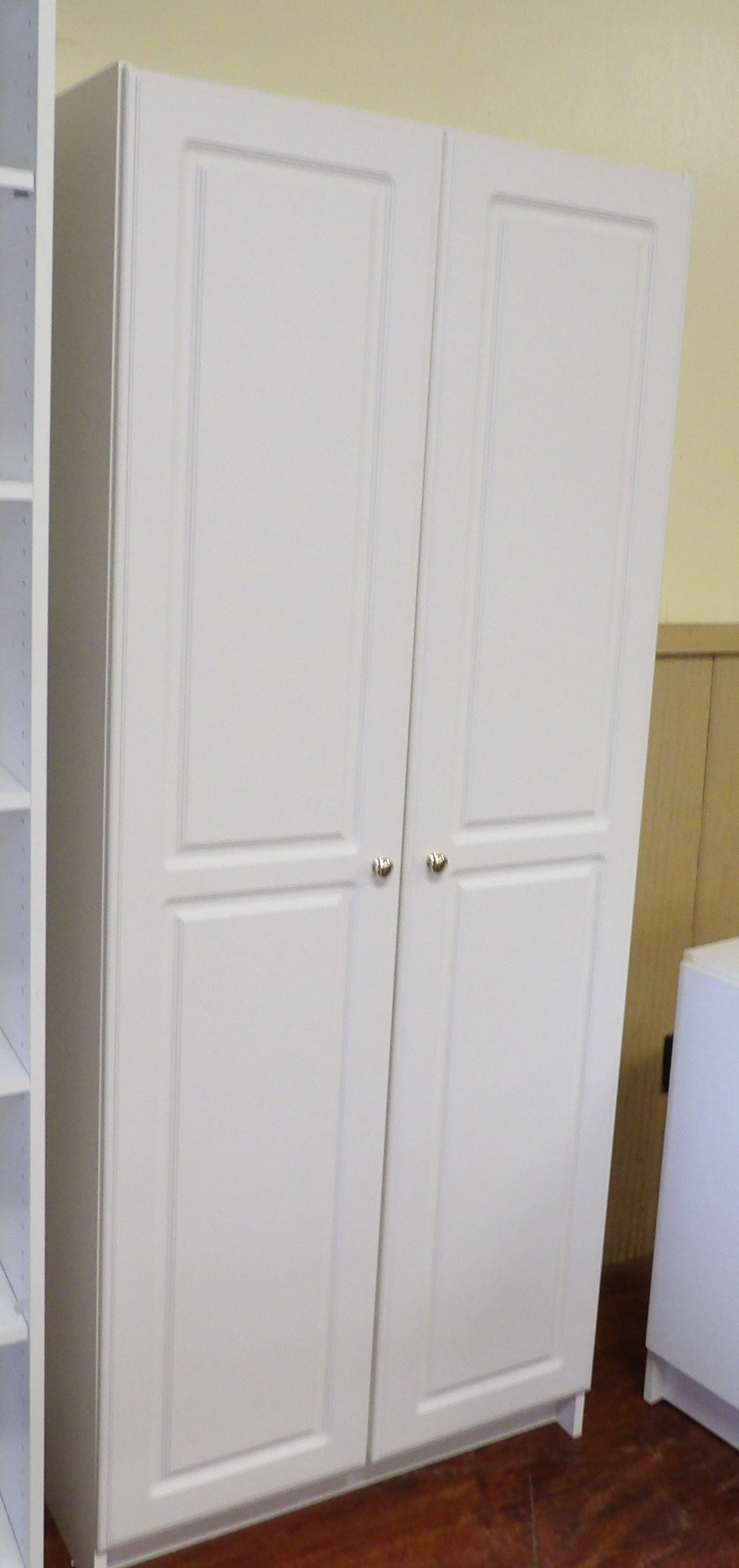 White 2 Door Wardrobe: White 2 Door Wardrobe with Recessed Panels. 30" Wide X 72" Tall. All measurements approximate. Please see photos for condition and details. Selling as is from 04281.