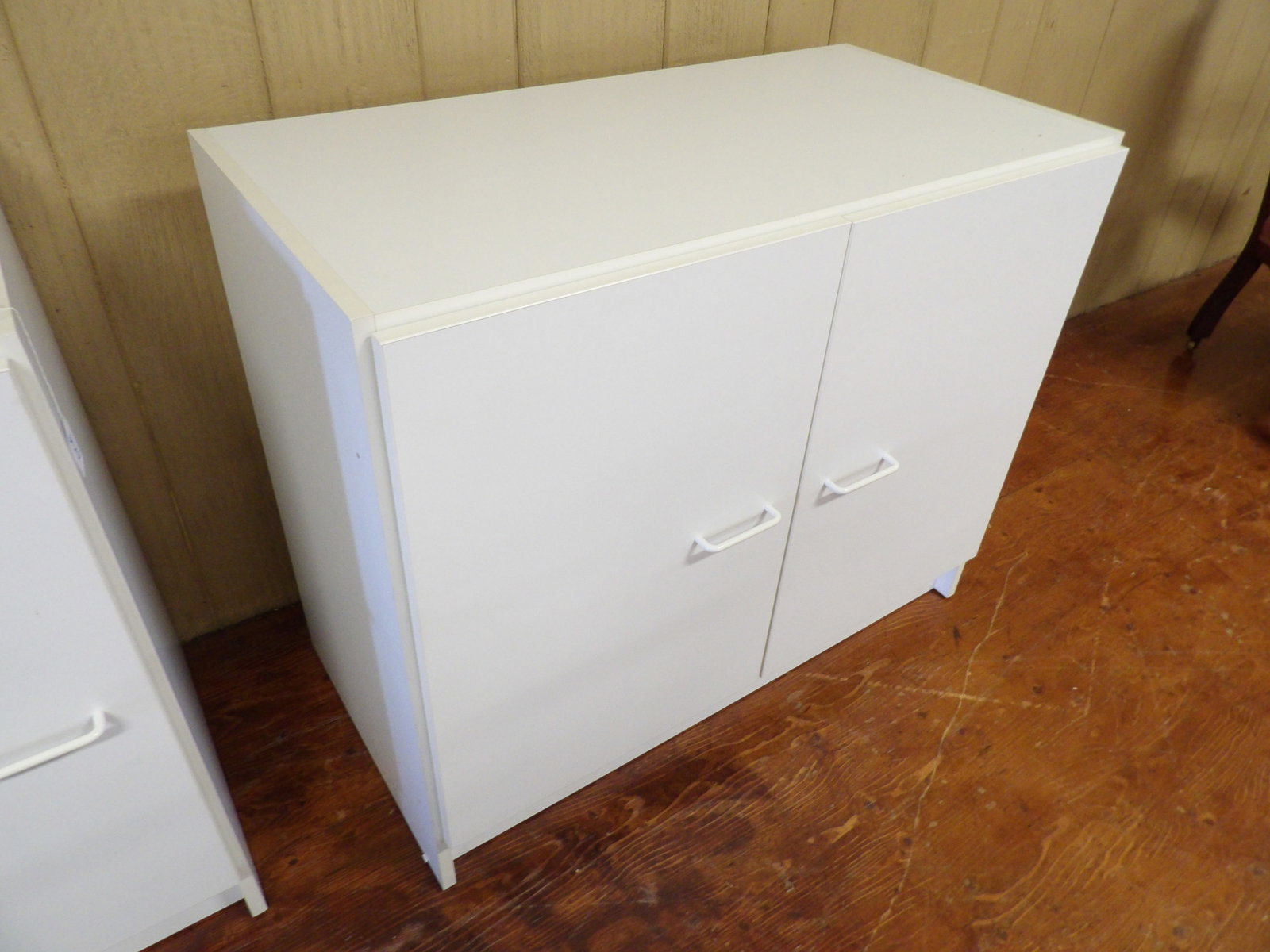 Two Door Storage Cabinet: White 2 Door Storage Cabinet. 36" Wide X 30" Tall. All measurements approximate. Please see photos for condition and details. Selling as is from 04281.
