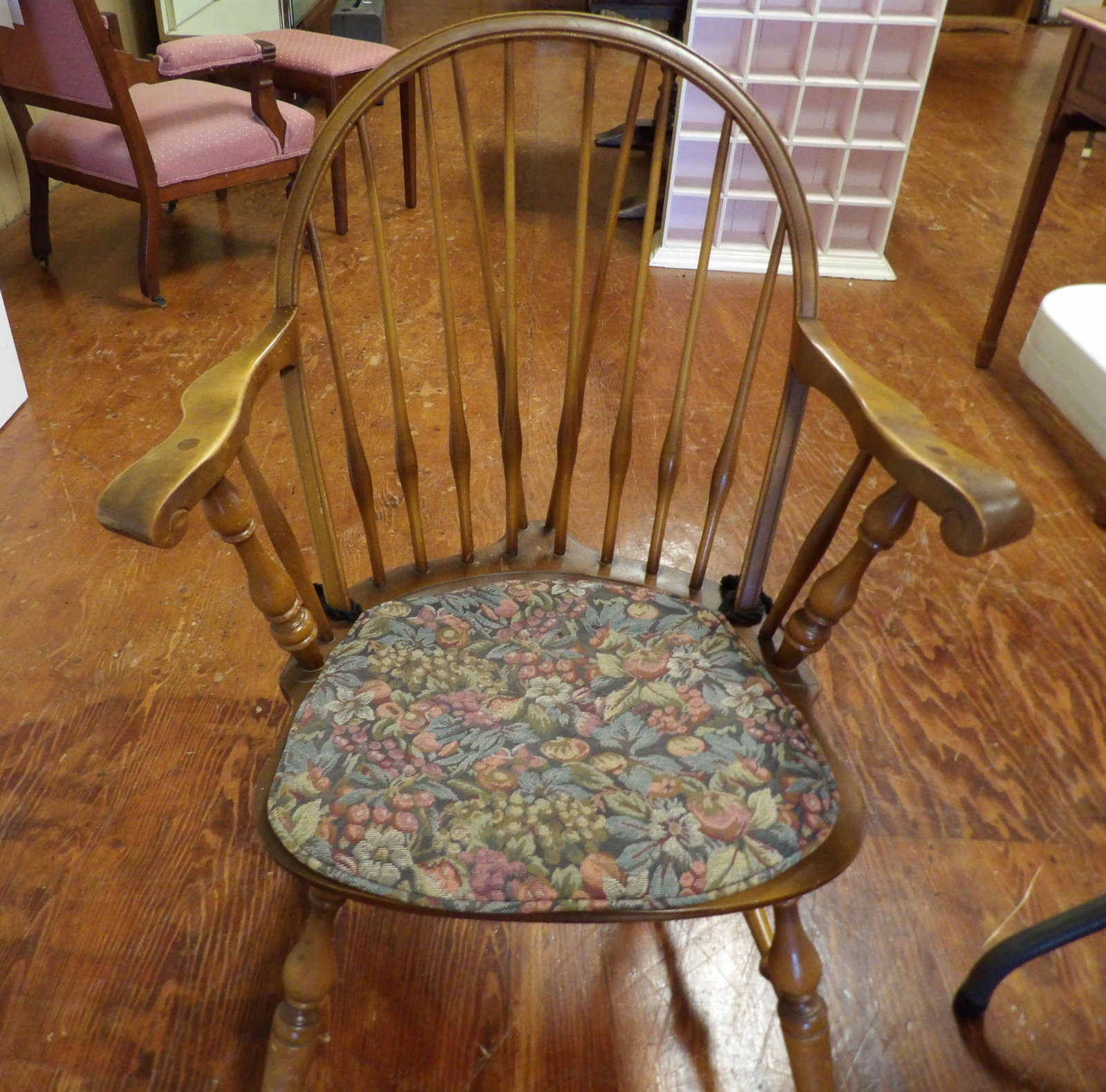 Antique Windsor Armchair with Cushion: Antique Windsor Armchair with Spindle Back and Floral Cushion. All measurements approximate. Please see photos for condition and details. Selling as is from 04281.