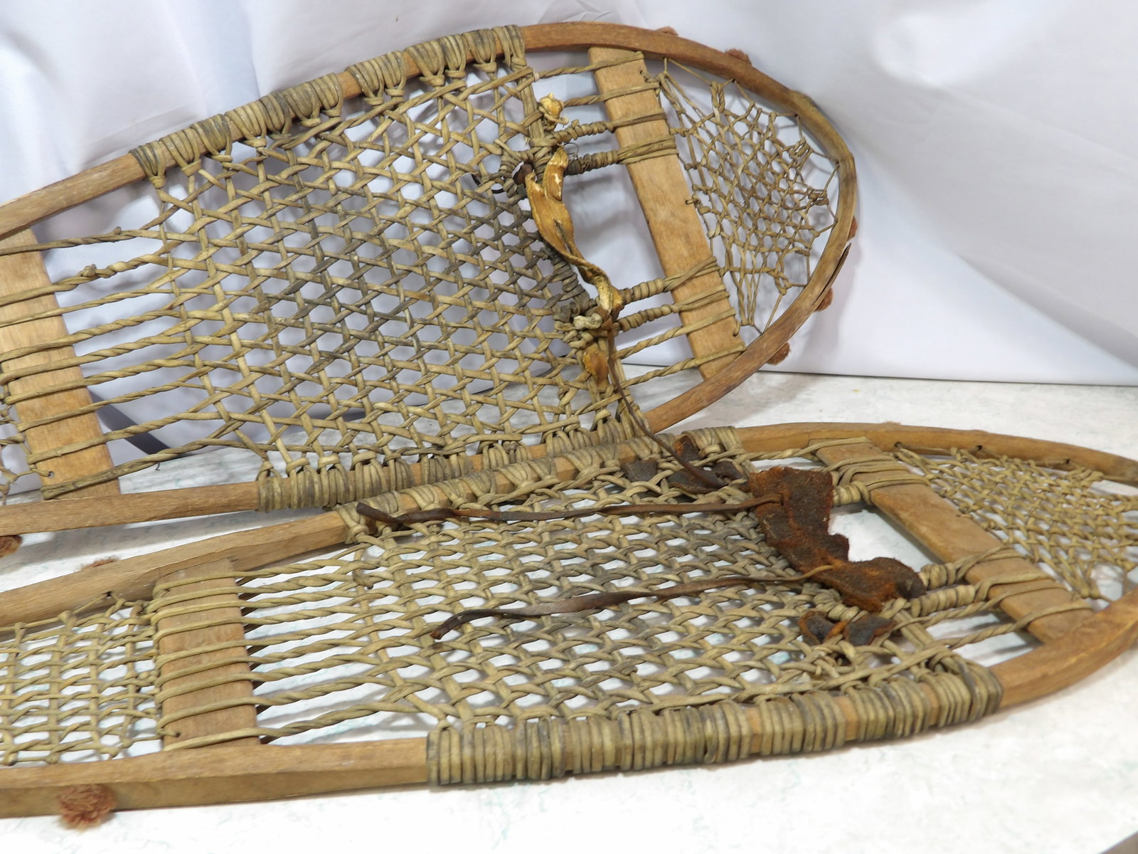 Native American Made Snowshoes: Early Native American Made Snowshoes. 12" X 48". All measurements approximate. Please see photos for condition and details. Selling as is from 04281.