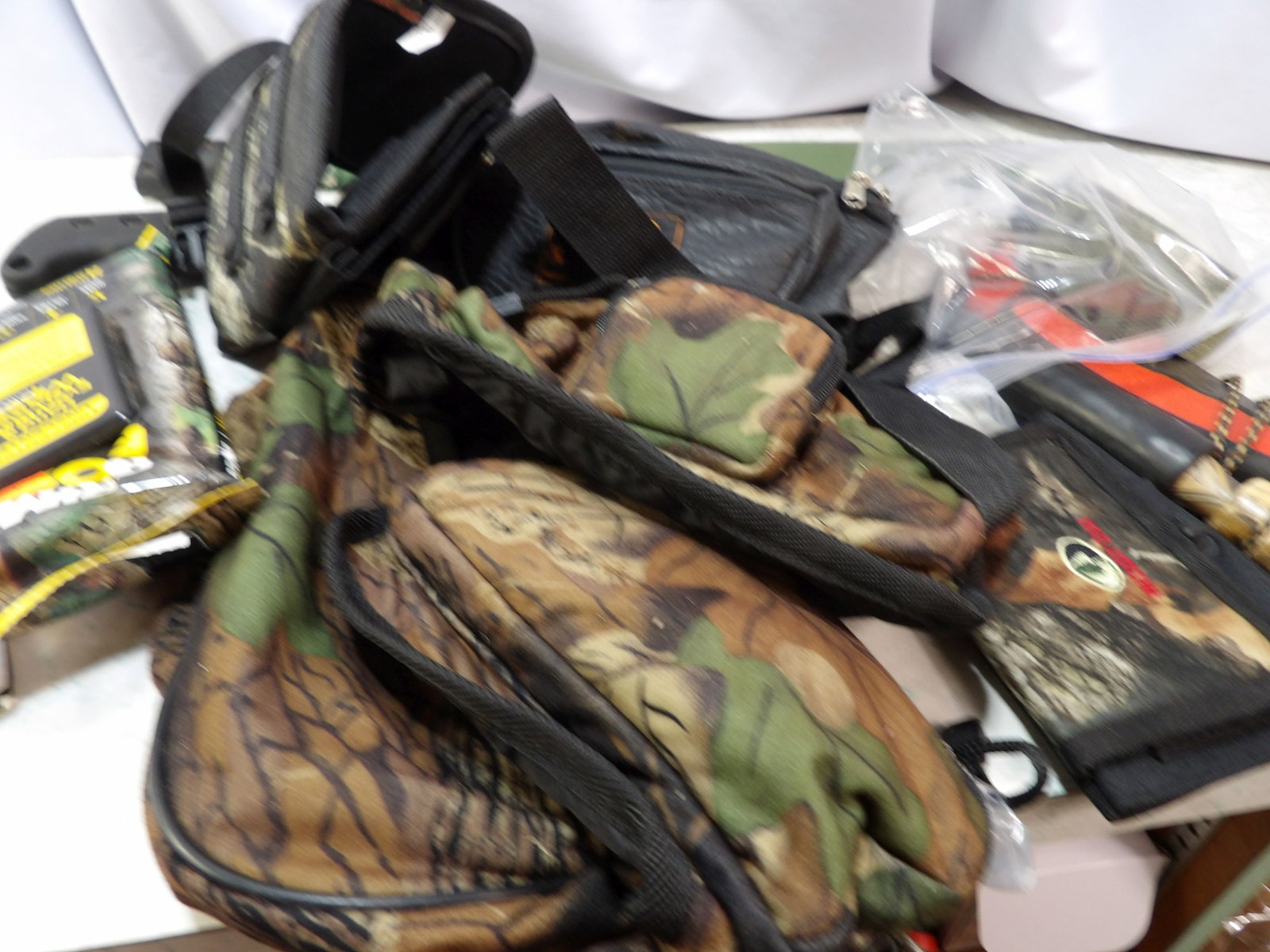 Camo Hunting Packs, Calls and Machetes: Camo Hunting Packs, Calls and A Couple of Machetes. All measurements approximate. Please see photos for condition and details. Selling as is from 04281.