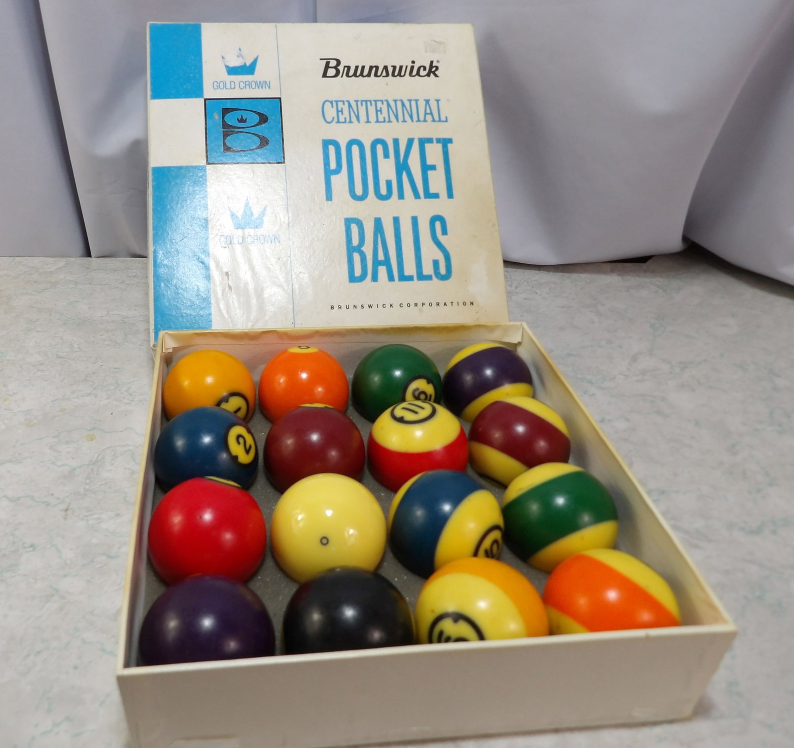 Brunswick Gold Crown Pool Ball Set: Brunswick Centennial Gold Crown Pool Ball Set in Original Box. All measurements approximate. Please see photos for condition and details. Selling as is from 04281.
