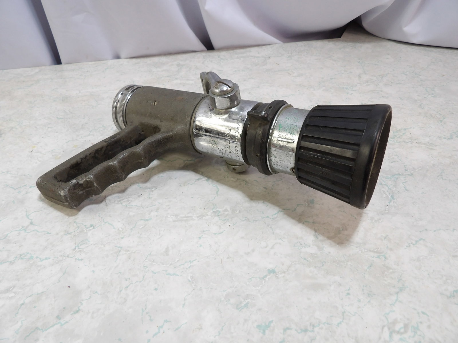 Elkhart Pistol Grip Firehose Nozzle: 1.5 Inch Vintage Elkhart Pistol Grip Firehose Nozzle. All measurements approximate. Please see photos for condition and details. Selling as is from 04281.