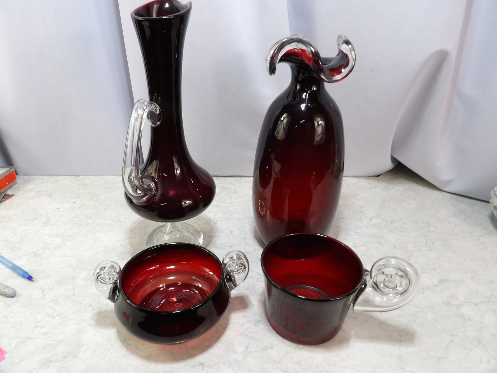 Set of 4 Ruby Red Art Glass Pieces: Set of 4 Ruby Red Art Glass Decorative Pieces. Likely from Poland. All measurements approximate. Please see photos for condition and details. Selling as is from 04281.