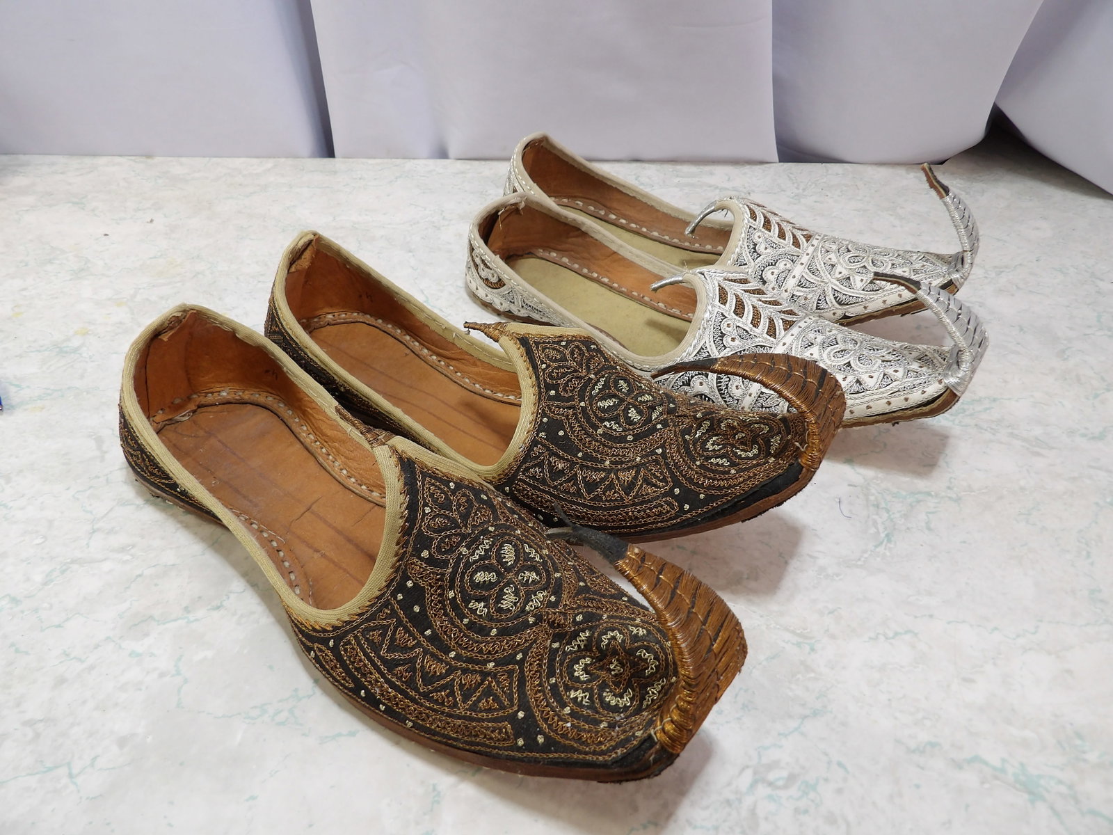 2 Pair of Indian Jutti/Mojari Shoes: 2 Pair of Indian Jutti/Mojari Shoes. Embroidered in Black and Silver. All measurements approximate. Please see photos for condition and details. Selling as is from 04281.