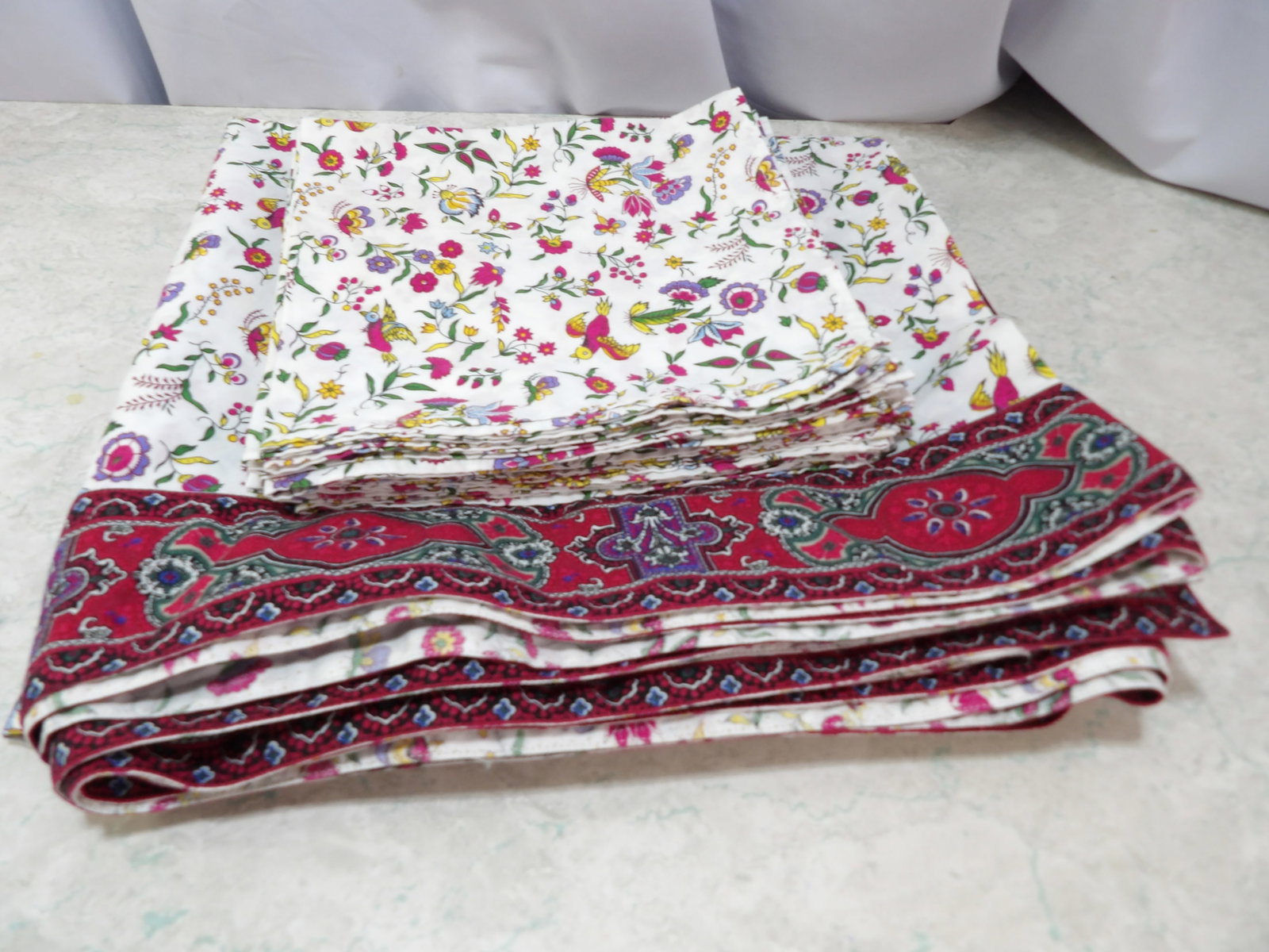 Mistral French Tablecloth and 12 Matching Napkins: 56" X 120" Mistral French Tablecloth and 12 Matching Napkins. All measurements approximate. Please see photos for condition and details. Selling as is from 04281.