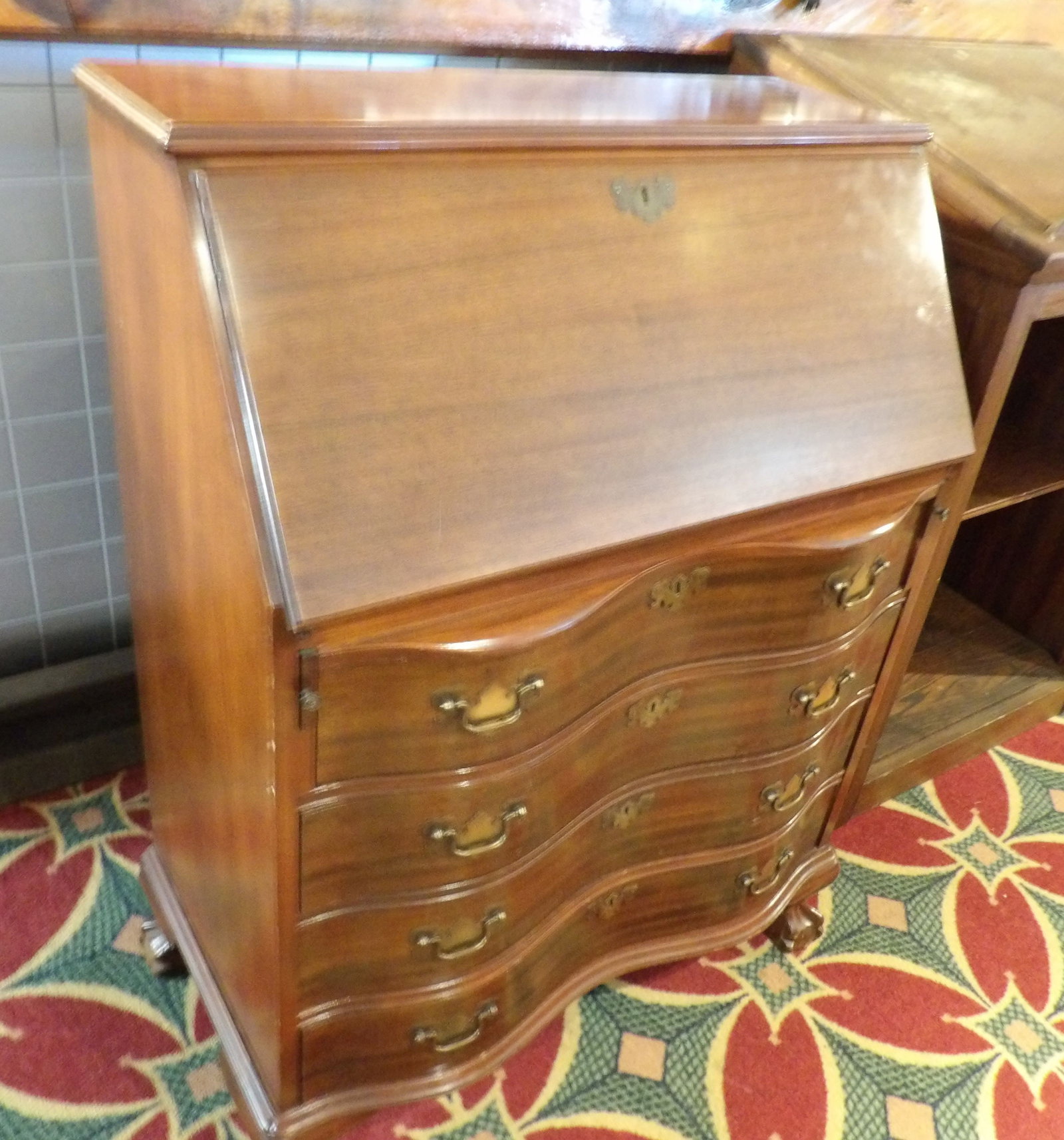 Mahogany Slant Front Secretary Desk with Drawers: Fantastic Vintage Mahogany Slant Front Secretary Desk. Serpentine Drawers. Ball and Claw Feet. Along with LiveShip (handled by LiveAuctioneers), we also can have a local shipper package and ship your