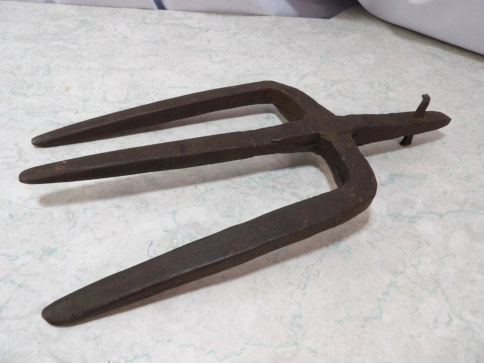 Hand-Forged Three Tine Iron Trident Pitchfork Head: Antique Hand-Forged Three Tined Iron Trident Pitchfork Head. 14" Long. Along with LiveShip (handled by LiveAuctioneers), we also can have a local shipper package and ship your purchases. Just choose