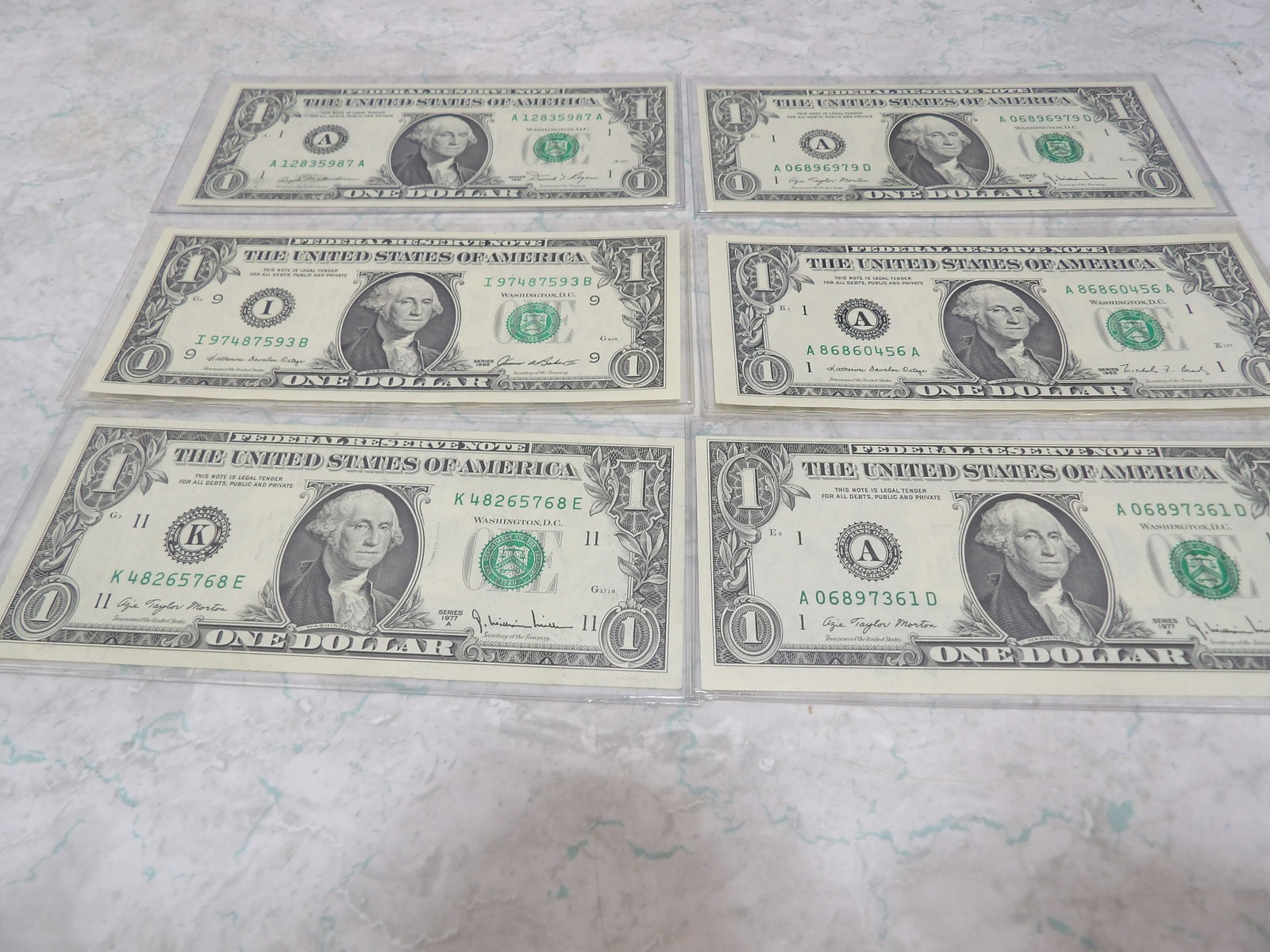 Collection of 6 Assorted Uncirculated $1 Bills in Protective Covers (1 of 3)