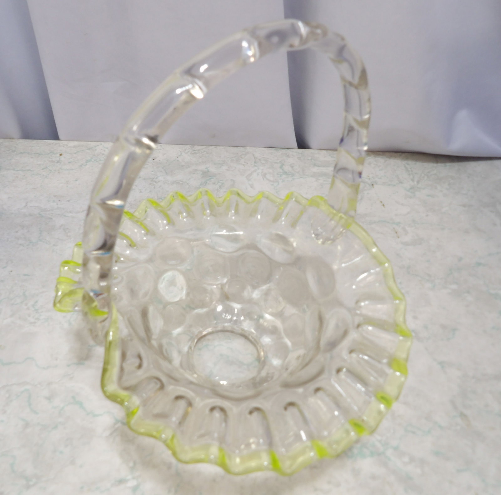 Clear Glass Basket with Crimped Rim: Clear Glass Basket with Crimped Rim and Applied Handle. Along with LiveShip (handled by LiveAuctioneers), we also can have a local shipper package and ship your purchases. Just choose buyer arranges