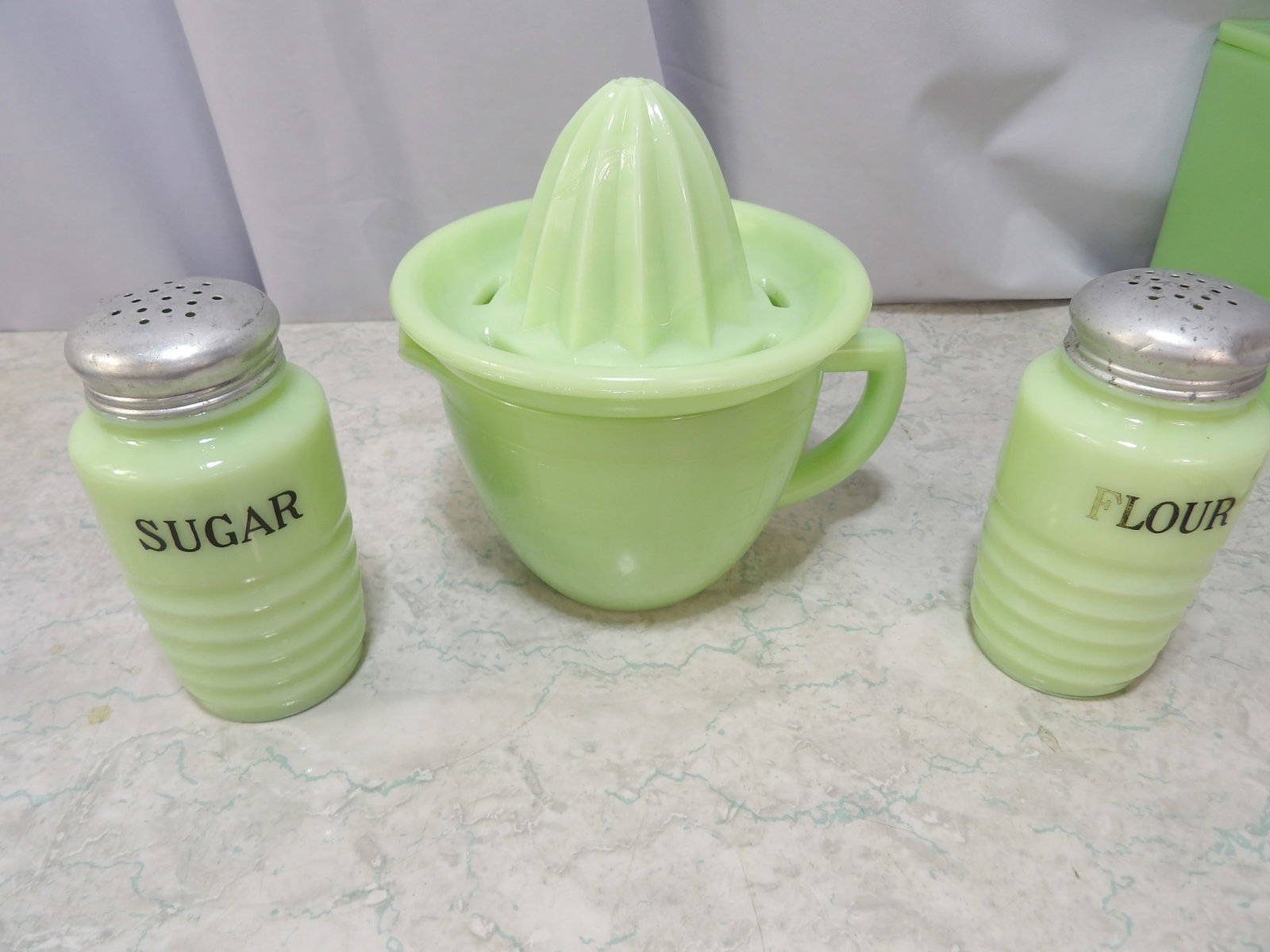Jadeite Glass Juice Reamer with Ribbed Kitchen Shakers: Vintage Jadeite Glass Juicer Reamer with Ribbed Kitchen Shakers. Along with LiveShip (handled by LiveAuctioneers), we also can have a local shipper package and ship your purchases. Just choose buyer