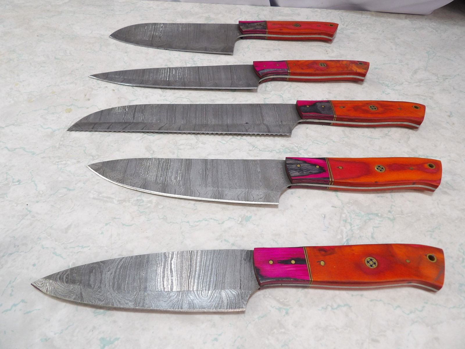 Lot of 5 Damascus Steel Kitchen Knives: Lot of 5 Handmade Damascus Steel Kitchen Knives. Along with LiveShip (handled by LiveAuctioneers), we also can have a local shipper package and ship your purchases. Just choose buyer arranges