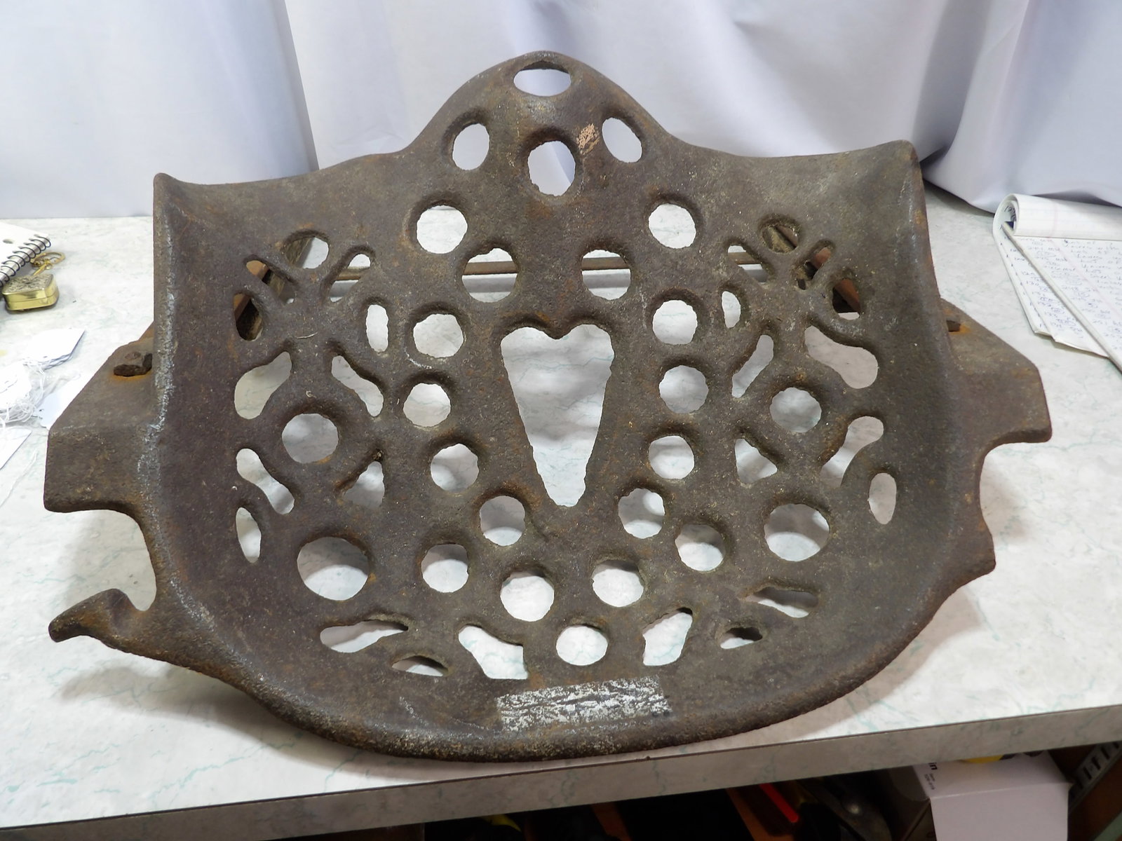 Cast Iron Tractor Seat with Heart Design: Antique Cast Iron Tractor Seat with Heart Design. Along with LiveShip (handled by LiveAuctioneers), we also can have a local shipper package and ship your purchases. Just choose buyer arranges