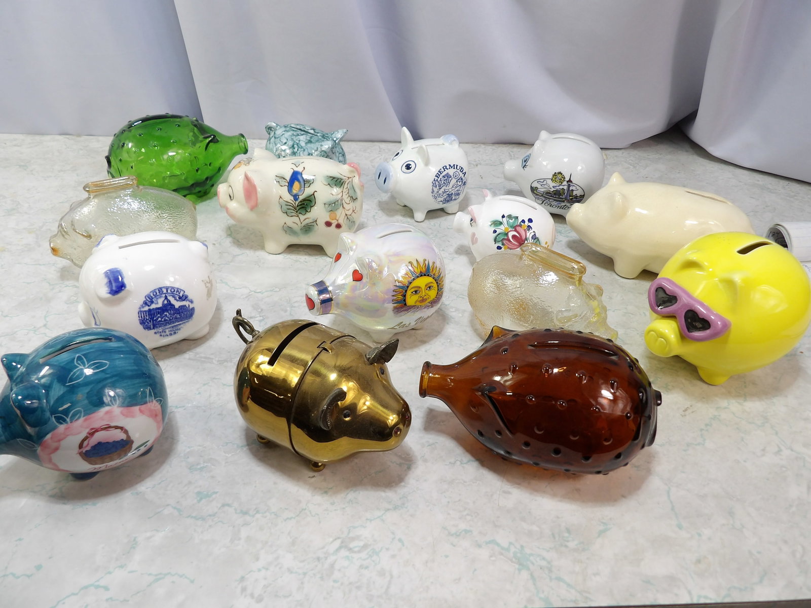 Collection of 15 Decorative Piggy Banks: Collection of 15 Vintage and Modern Decorative Piggy Banks. Along with LiveShip (handled by LiveAuctioneers), we also can have a local shipper package and ship your purchases. Just choose buyer