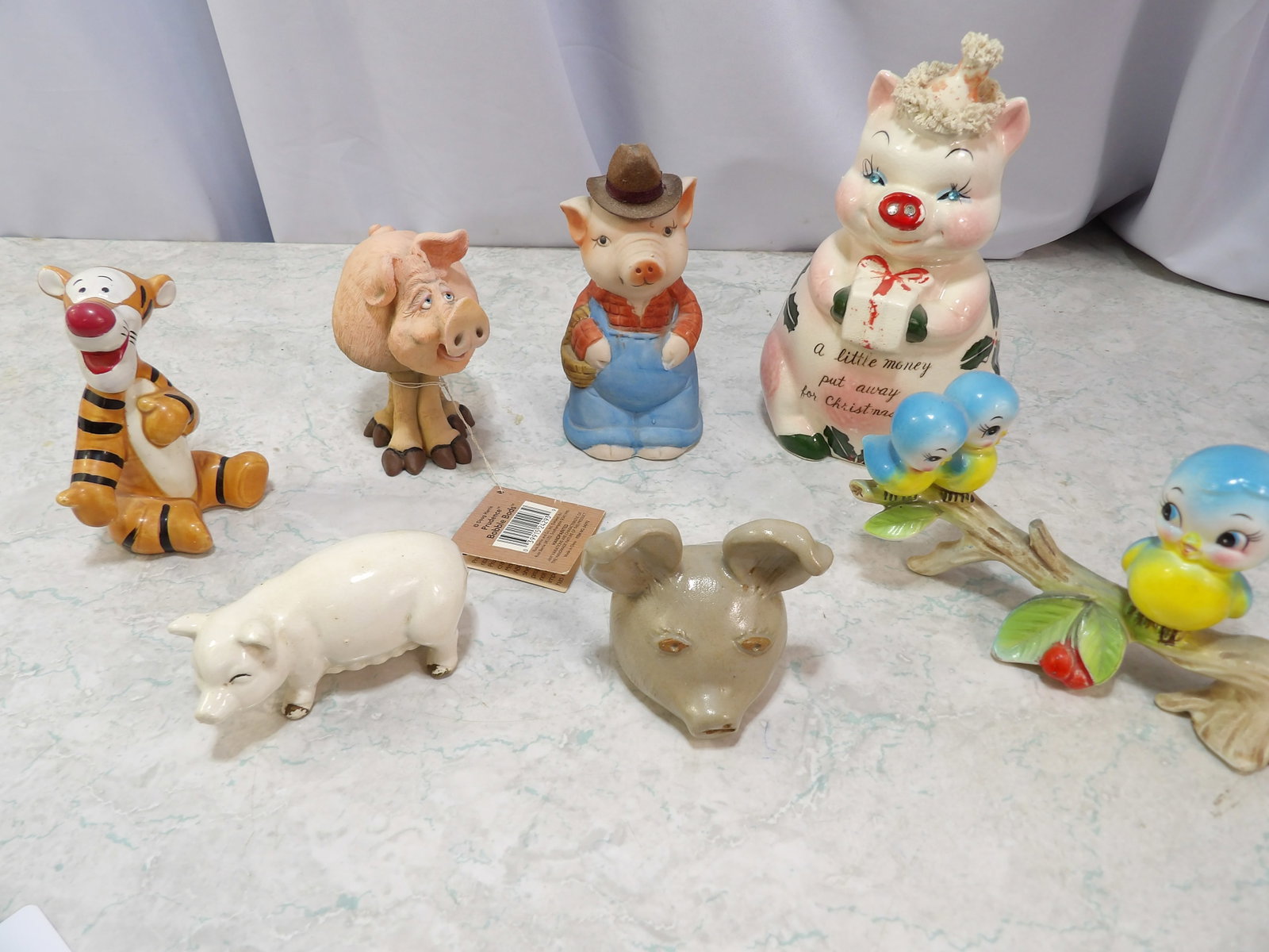Lot of Assorted Figurines, Pigs, Disney, etc.: Lot of Assorted Figurines, Pigs, Disney, Others. Along with LiveShip (handled by LiveAuctioneers), we also can have a local shipper package and ship your purchases. Just choose buyer arranges