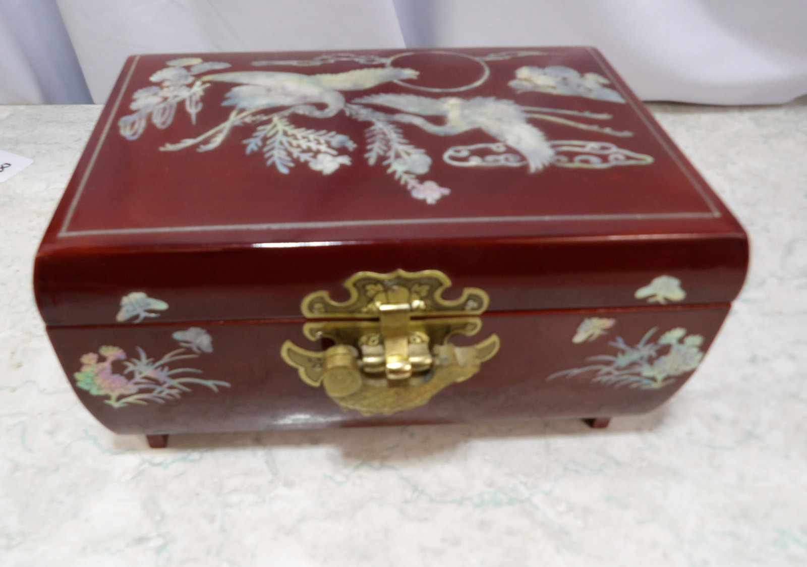 Korean Lacquered Wood Jewelry/Music Box with Inlay: Vintage Korean Lacquered Wood Jewelry/Music Box with Mother of Pearl Inlay. Along with LiveShip (handled by LiveAuctioneers), we also can have a local shipper package and ship your purchases. Just