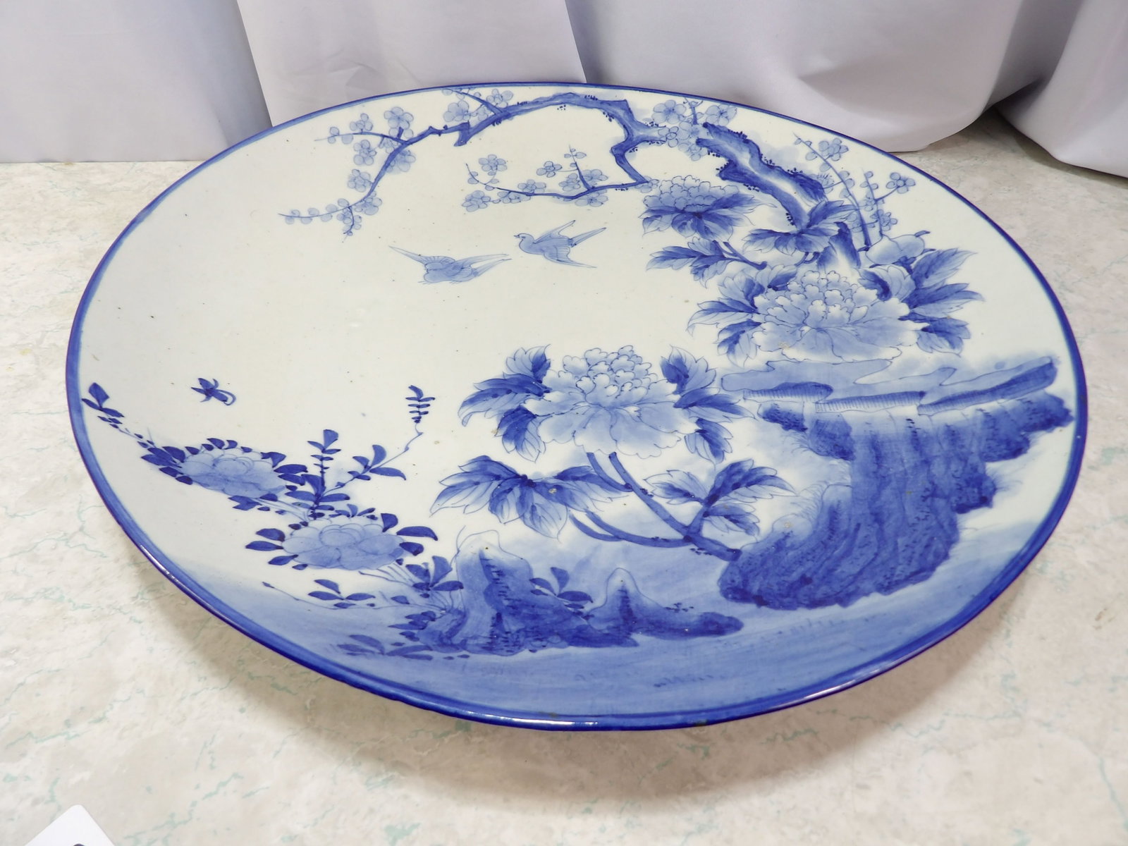 Large Blue and White Porcelain Charger: Large Antique Blue and White Porcelain Charger with Floral Bird Motif. Along with LiveShip (handled by LiveAuctioneers), we also can have a local shipper package and ship your purchases. Just choose