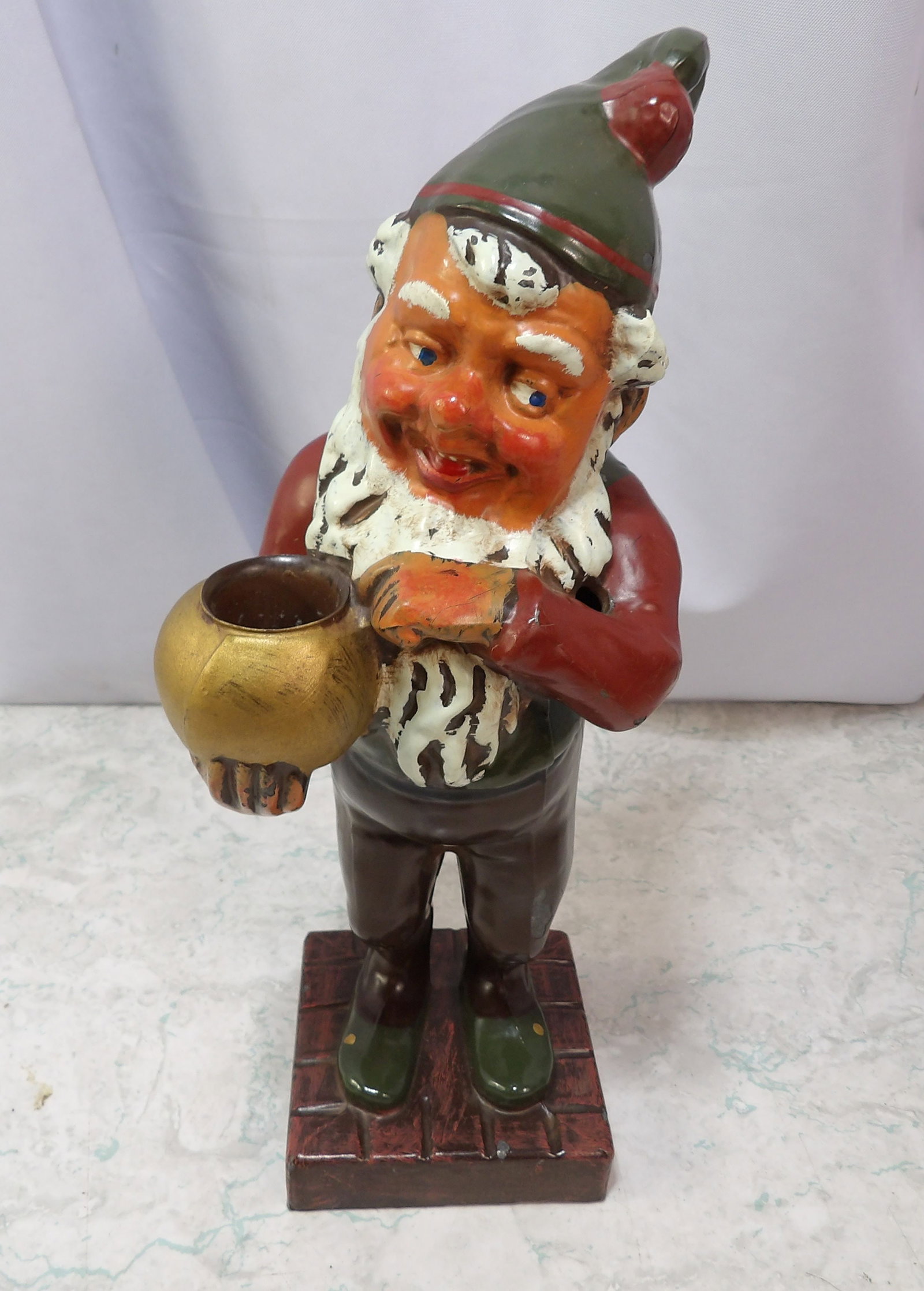 Cast Metal Gnome Leprechaun Candle Holder: Vintage Petites Choses Cast Metal Gnome Leprechaun Candle Holder. 11" Tall. Along with LiveShip (handled by LiveAuctioneers), we also can have a local shipper package and ship your purchases. Just