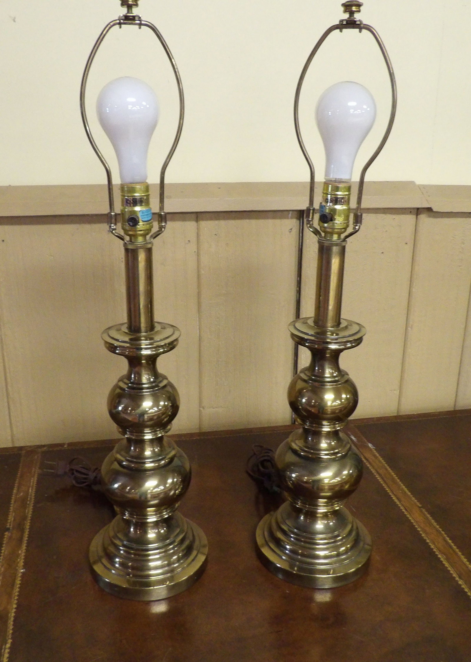 Pair of Vintage Stiffel Brass Table Lamps: Pair of Vintage Stiffel Mid Century Hollywood Regency Brass Table Lamps. 26" Tall. Along with LiveShip (handled by LiveAuctioneers), we also can have a local shipper package and ship your purchases.