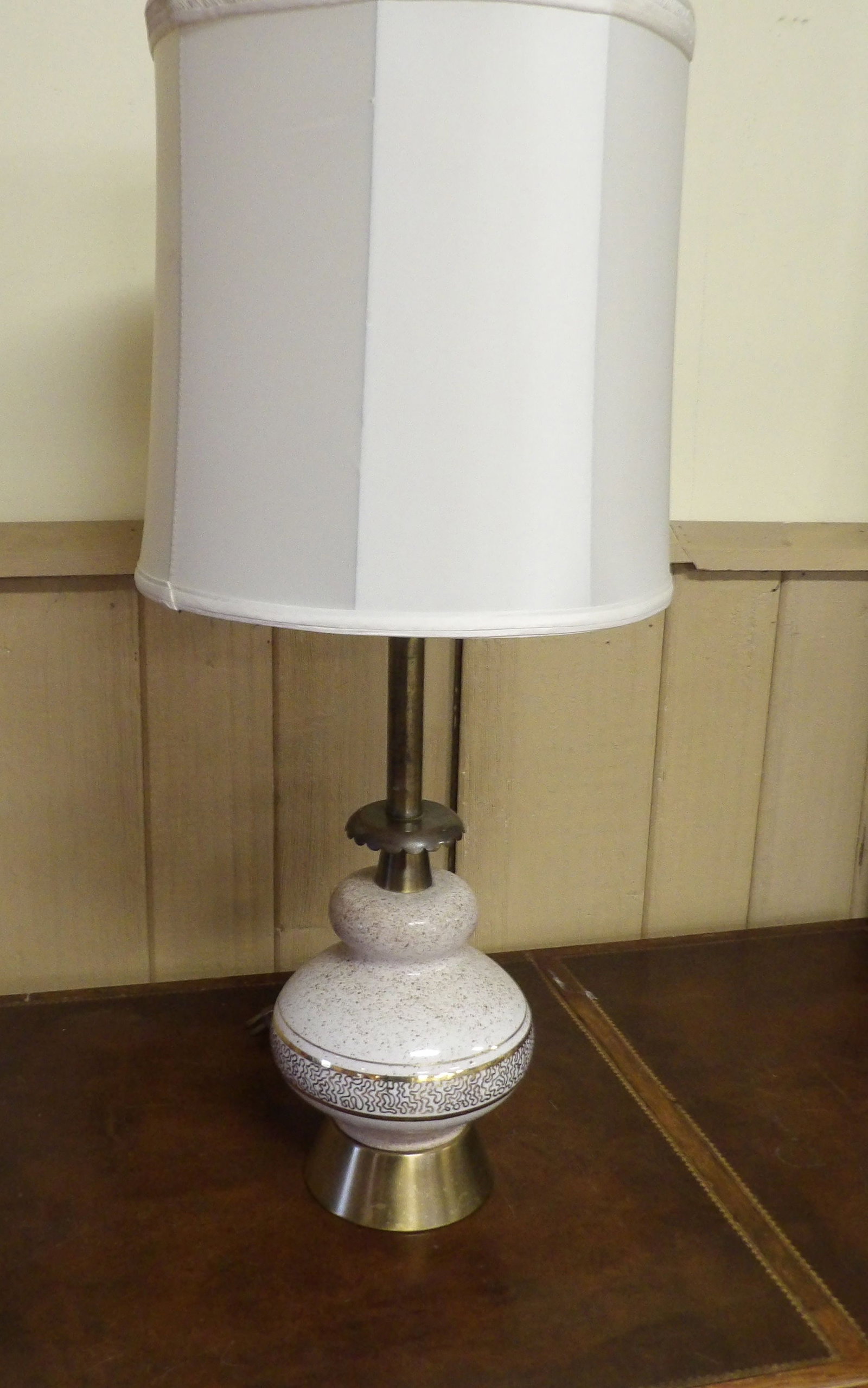 Speckled Ceramic Genie Table Lamp: Mid Century Modern Speckled Ceramic Genie Table Lamp with Gold Trim. 32" Tall. Along with LiveShip (handled by LiveAuctioneers), we also can have a local shipper package and ship your purchases. Just