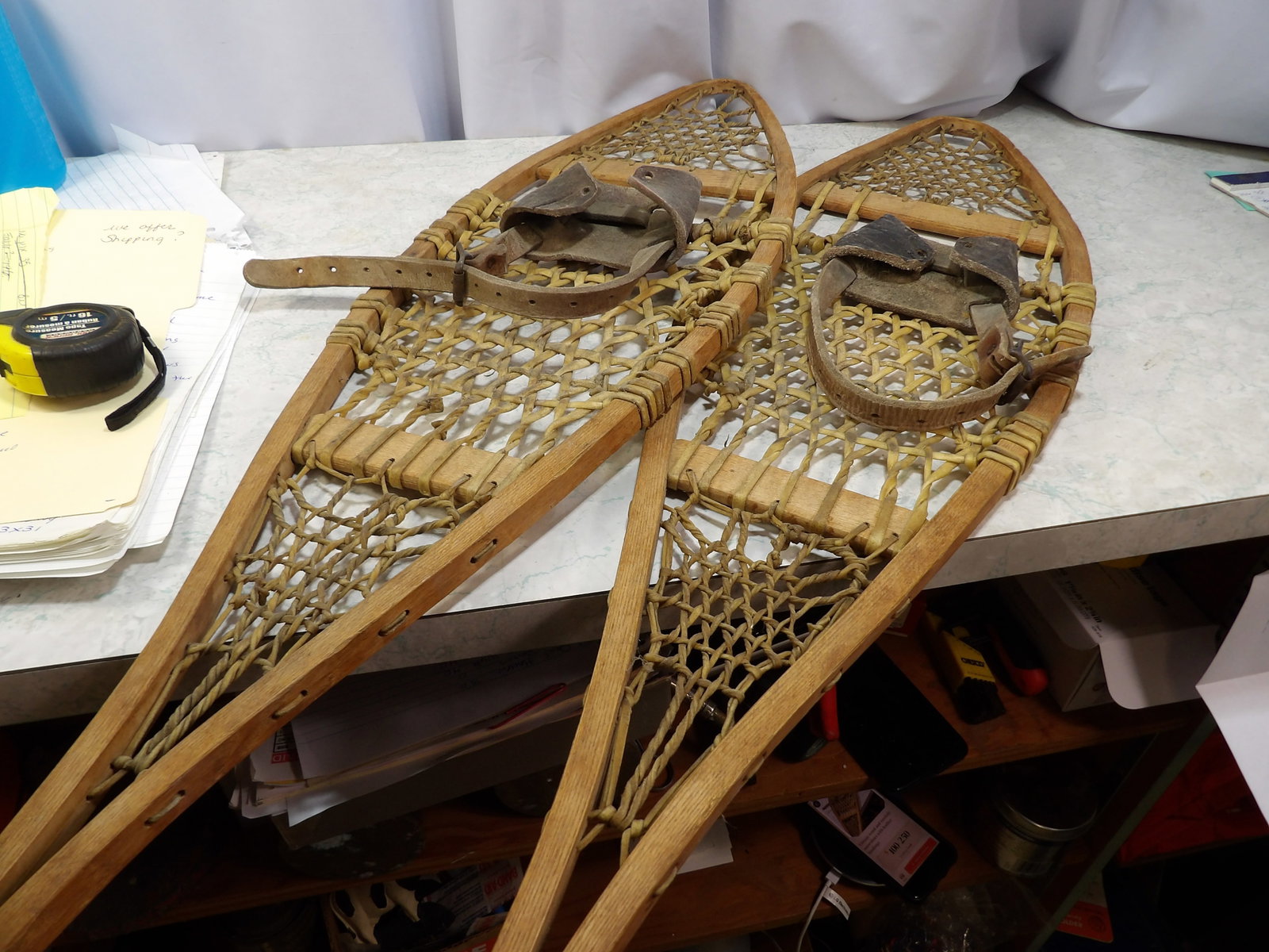 Pair of Vintage Wood and Rawhide Snowshoes: Pair of Vintage Wood and Rawhide Snowshoes. Leather bindings. 40". Along with LiveShip (handled by LiveAuctioneers), we also can have a local shipper package and ship your purchases. Just choose