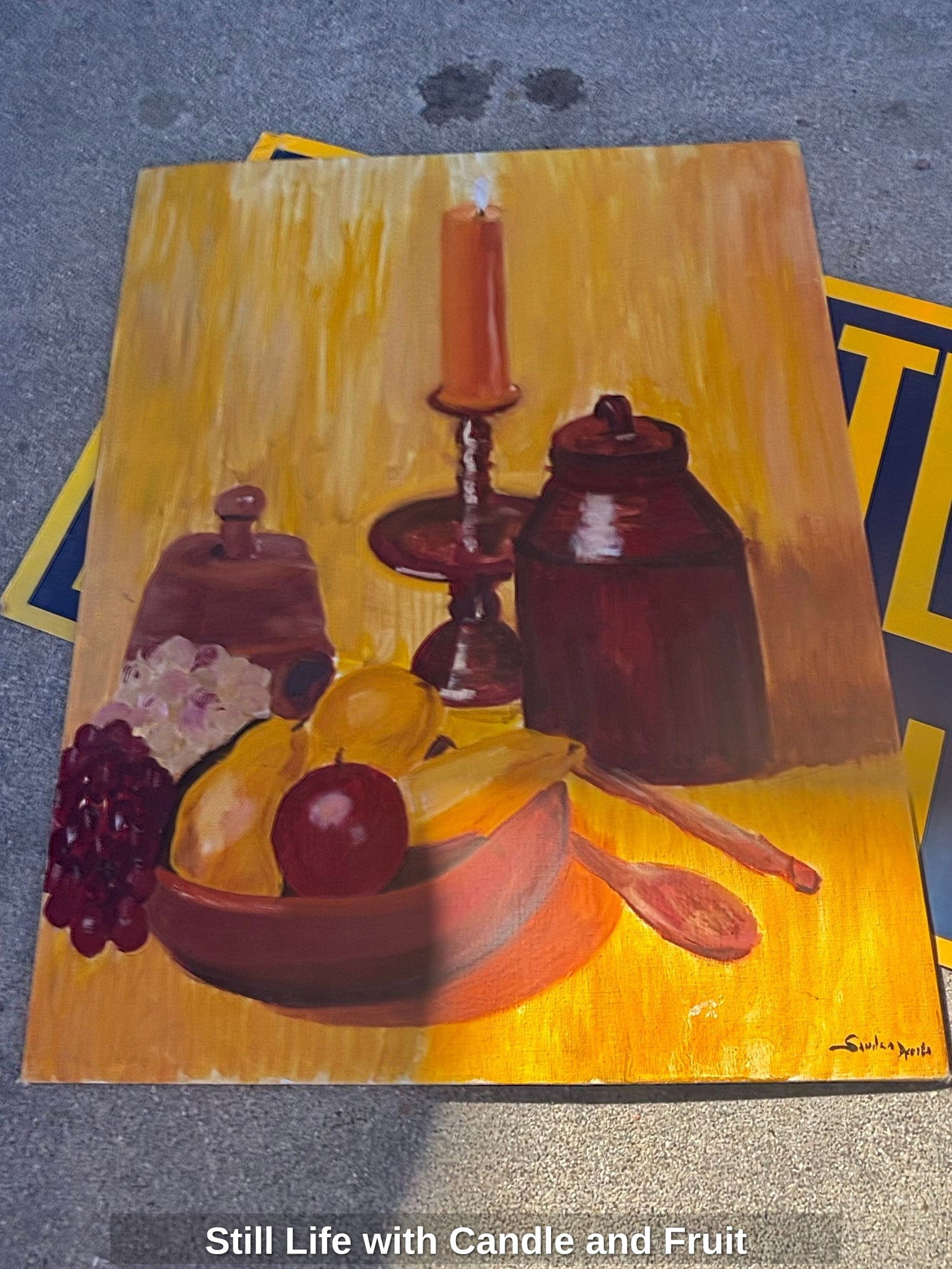 Still Life with Candle and Fruit: This oil on canvas painting depicts a traditional still life arrangement featuring a lit candle in a dark candlestick, a bowl of fruit (including grapes, bananas, and an apple), and two earthenware