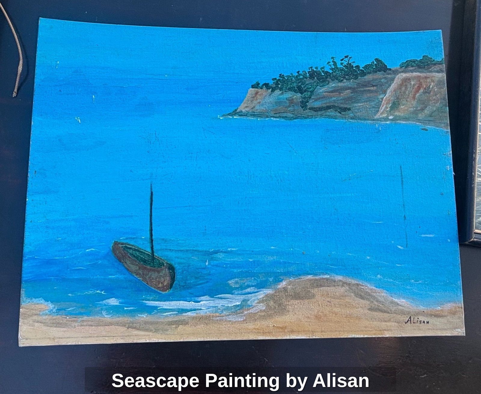 Seascape Painting by Alisan: This is an acrylic painting on canvas depicting a coastal scene. The artwork features a sandy beach on the left, meeting a vibrant blue sea. In the water, a dark, umbrella-like object is partially