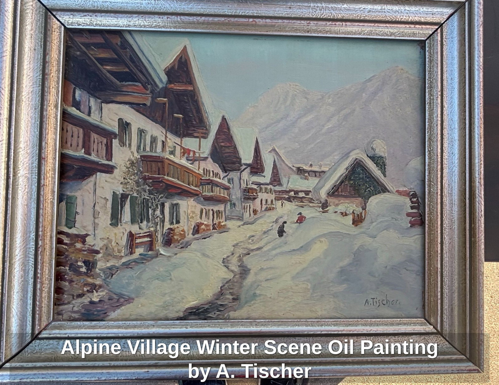 Alpine Village Winter Scene Oil Painting by A. Fischer: This is an oil on canvas painting depicting a charming alpine village blanketed in snow. The artwork showcases traditional European architecture with snow-laden roofs and visible wooden beams, set aga