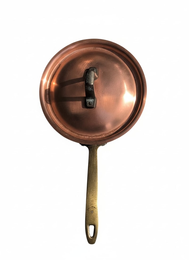 Vintage Paul Revere Limited Edition Oval Copper Roasting Pan with Brass Handles: This vintage sauté pan is constructed from high-quality copper, known for its excellent heat conductivity and responsiveness, making it ideal for precise cooking. It features sturdy brass handles,