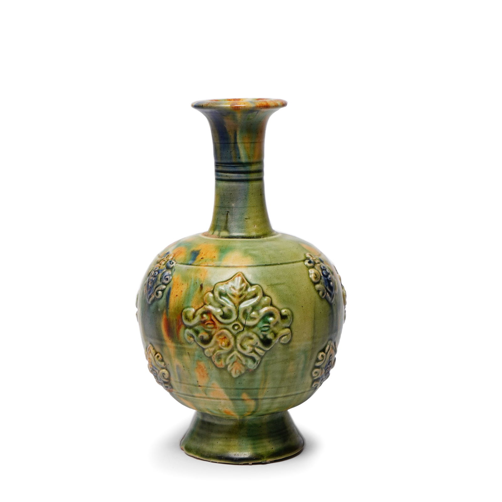 Tang Dynasty Sancai Glazed Vase with Applied Floral Decorations: H:19cmW:10cm This is a Tang Dynasty sancai-glazed long-necked vase, featuring a flared mouth, slender neck, rounded body, and high foot, with a dignified and well-proportioned form. The body is