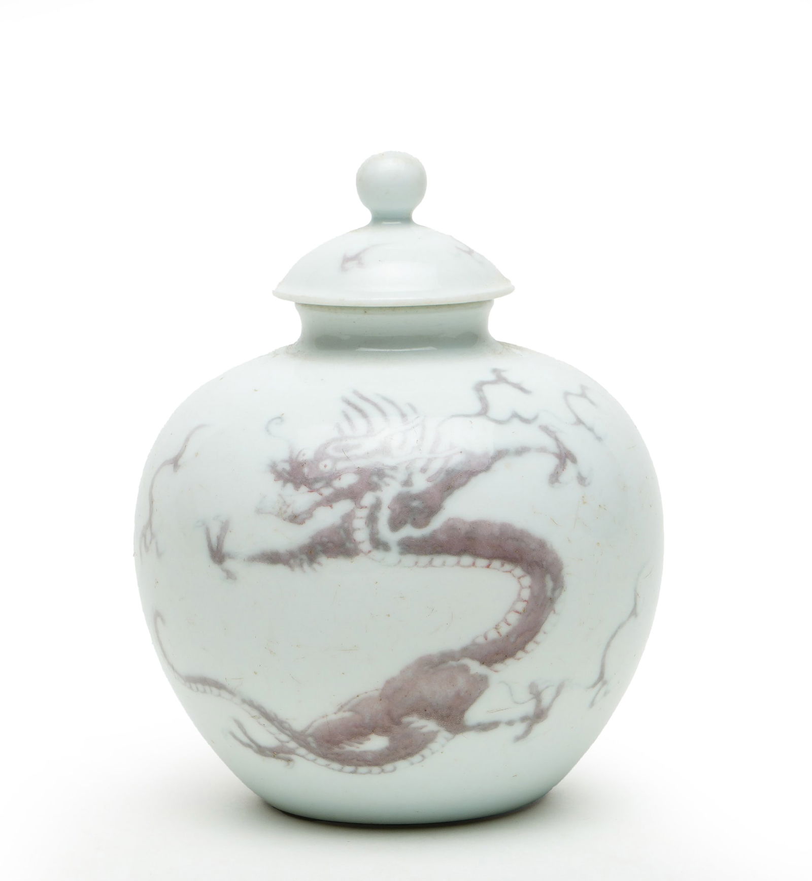 Qing Kangxi Period Underglaze Red Jar with Cover Decorated with Dragon and Cloud Patterns: H:11.5cmW:7.3cm This is an underglaze red jar with a cover decorated with dragon and cloud patterns from the Kangxi period of the Qing Dynasty, a fine underglaze red work of the early Qing Dynasty.