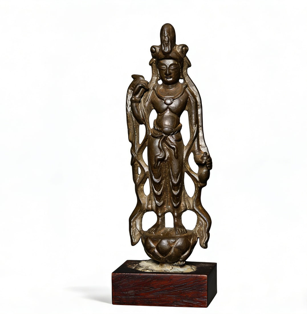 Tang Dynasty Bronze Standing Guanyin Statue in Relaxed Pose: H:15.7cmW:5cm This is a Late Tang Dynasty bronze standing Guanyin statue in a relaxed pose, a fine example of Tang Dynasty Guanyin sculpture. Made of bronze with a well-aged, deep patina and a