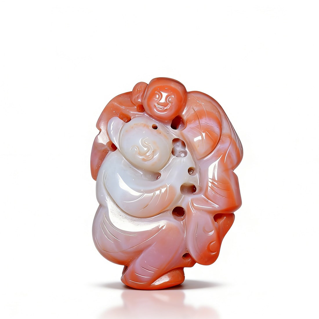 Qing Dynasty Southern Red Agate Color-Carved "Boy Playing" Handheld Ornament: H:4cmW:3.5cm This is a Qing Dynasty southern red agate color-carved "Boy Playing" handheld ornament, a fine portable scholar’s object. Carved from southern red agate, it uses red-white color