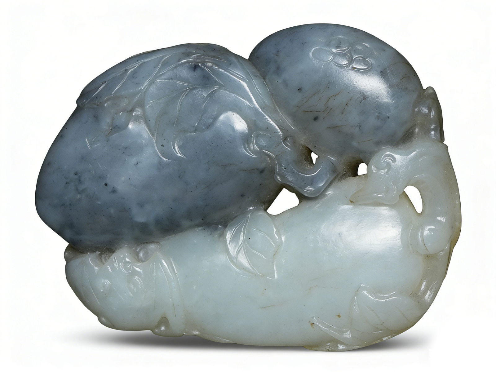 Qing Dynasty Blue-and-White Jade Color-Carved Handheld Ornament: H:3.8cmW:5.2cm This is a Qing Dynasty blue-and-white jade color-carved handheld ornament ("Monkey Presenting Peaches"), a fine characteristic jade scholar’s object. Carved from blue-and-white