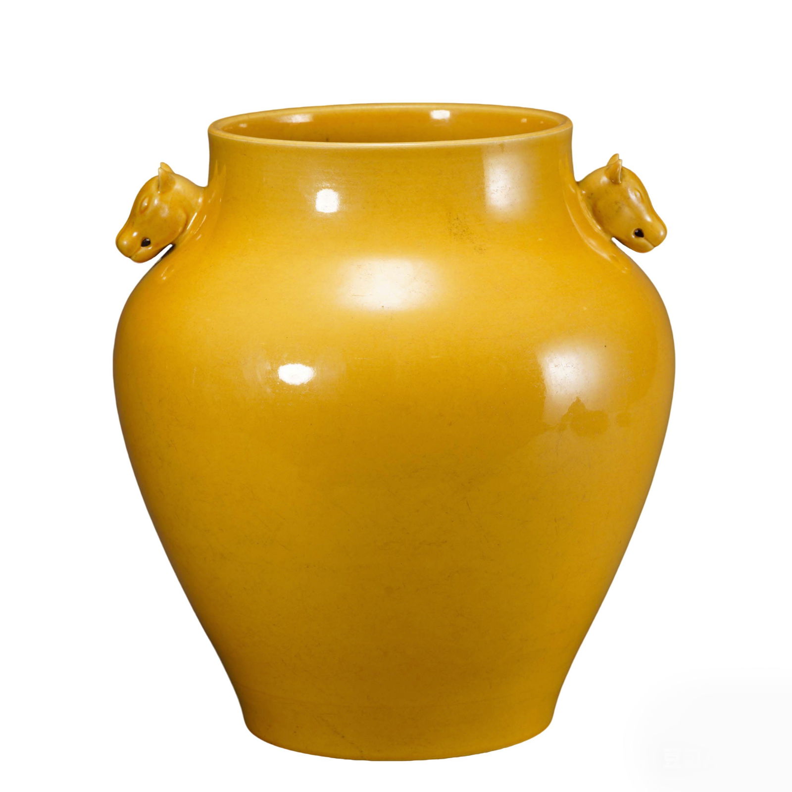 Qing Qianlong Period Yellow-Glazed Jar with Double Beast Head Handles: H:27.5cmW:25cm This is a Qing Qianlong period yellow-glazed jar with double beast head handles, a fine example of imperial monochrome-glazed porcelain. Fired from fine porcelain clay, the body is soli