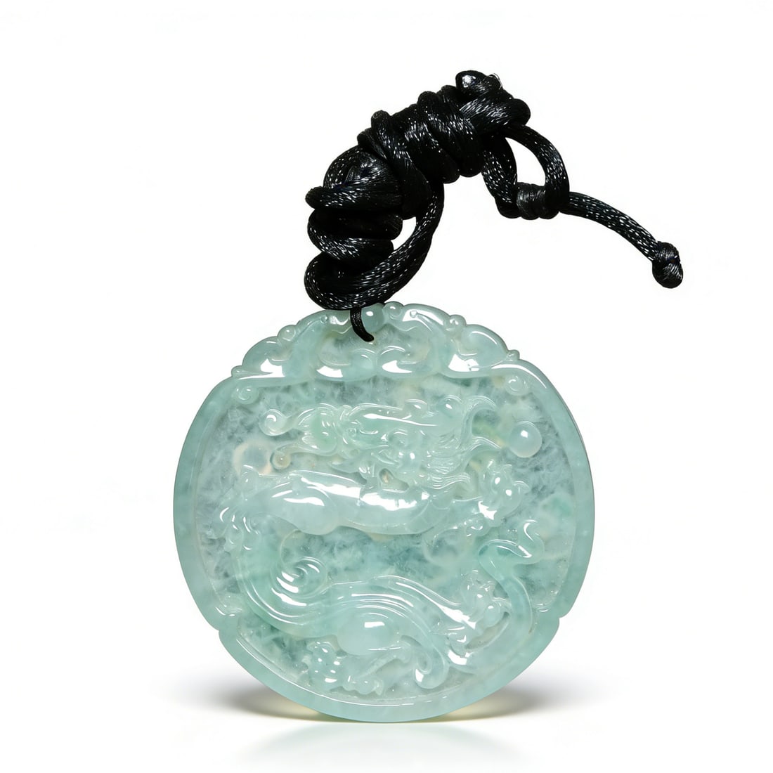 Jadeite Pendant: D:5.5cm This is a jadeite pendant with dragon and phoenix motifs, a fine jadeite ornament. Carved from ice-type jadeite with transparent, luminous texture and light, clear color; the body is relieved