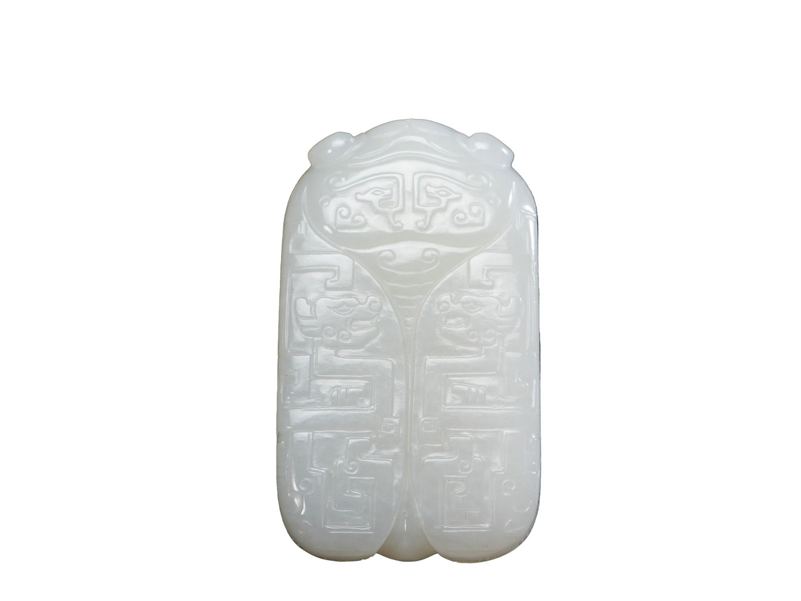 Qing Qianlong Period Hetian White Jade Plaque: L:5.8cmW:3.3cm his is a Hetian white jade plaque in archaic cicada form with decorative patterns from the Qianlong period of the Qing Dynasty, a fine archaistic jade work of the Qing court. The plaque