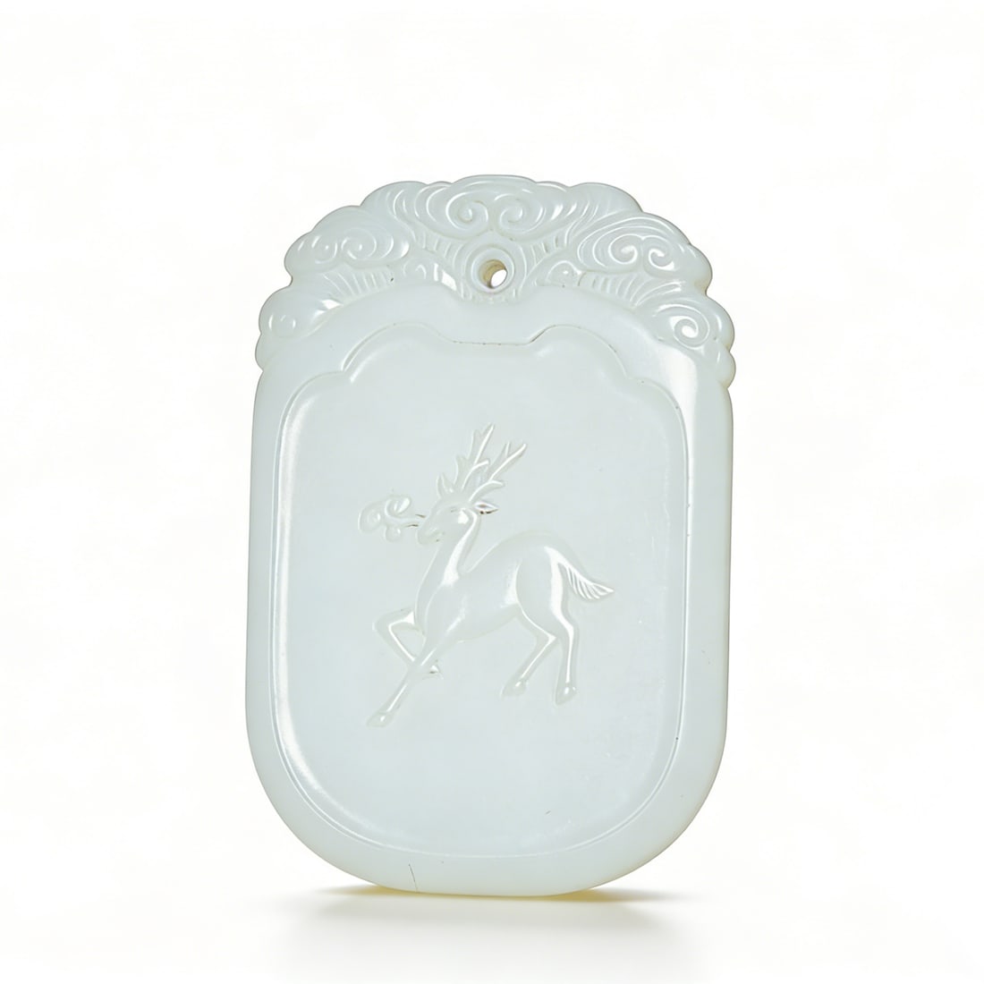 Qing Dynasty Hetian White Jade Plaque: H:5.5cmW:3.5cm This is a Qing Dynasty Hetian white jade plaque ("Spirit Deer Holding Ganoderma"), a fine auspicious jade ornament. Carved from Hetian white jade with warm, white texture; the plaque is