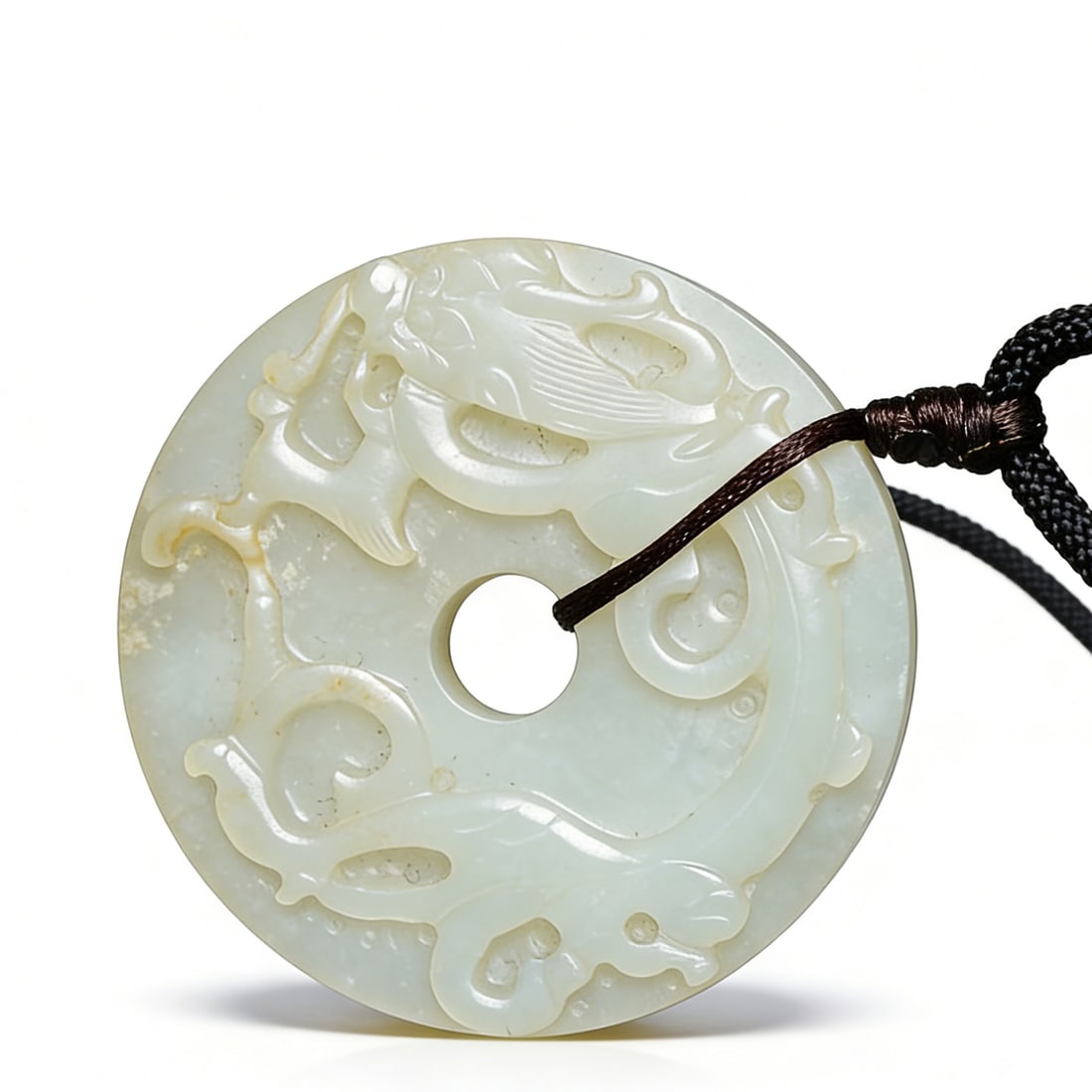 Qing Dynasty Hetian White Jade Bi-Disc: D:5.7cm This is a Qing Dynasty Hetian white jade bi-disc with relieved chi-dragon motifs, a fine traditional jade ritual object. Carved from Hetian white jade with warm, luminous texture; the body is