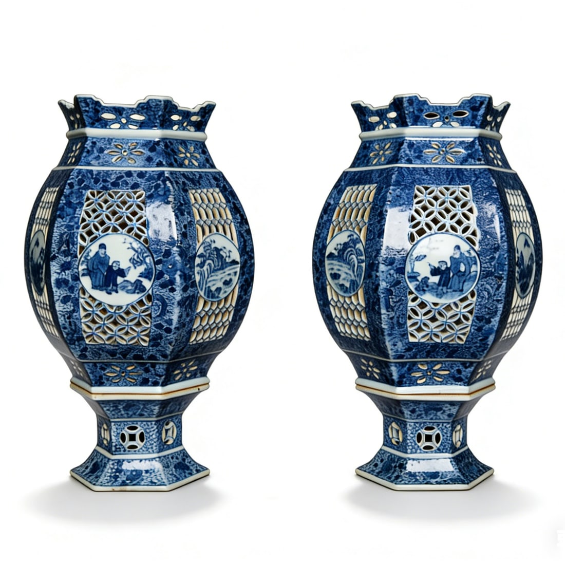 Qing Dynasty Pair of Blue and White Lantern Vases with Pierced Openwork and Figure Patterns: H:31cm W:17cm This is a pair of Qing Dynasty blue and white lantern vases with pierced openwork and figure patterns, fine examples of Qing blue and white porcelain. The vases have a hexagonal lantern