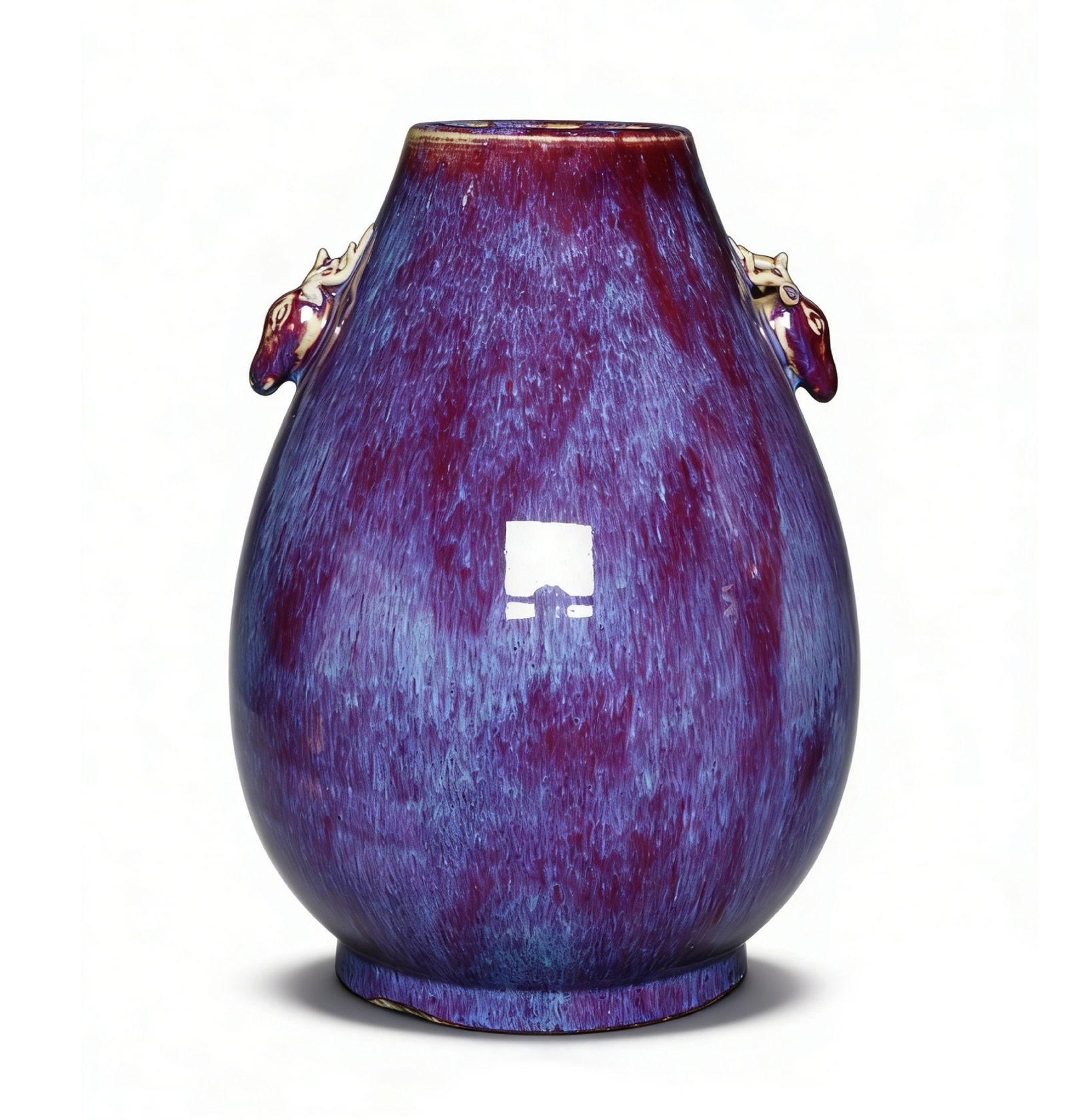 Qing Dynasty Flambé-Glazed Zun with Deer-Head Handles: H:30cmW:21cm This is a Qing Dynasty flambé-glazed zun with deer-head handles, an important imperial court decorative porcelain piece. Shaped with a constricted mouth and drooping belly, with deer-hea