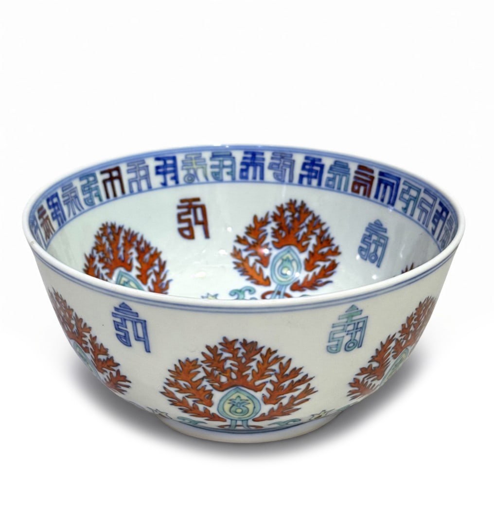 Qing Dynasty Doucai Bowl with "Longevity" Characters and Lotus Blossom Patterns: H:8.5cm W:16.5cm This is a Qing Dynasty doucai bowl with "longevity" characters and lotus blossom patterns, a fine example of imperial court daily-use porcelain. Fired from fine white porcelain, the b
