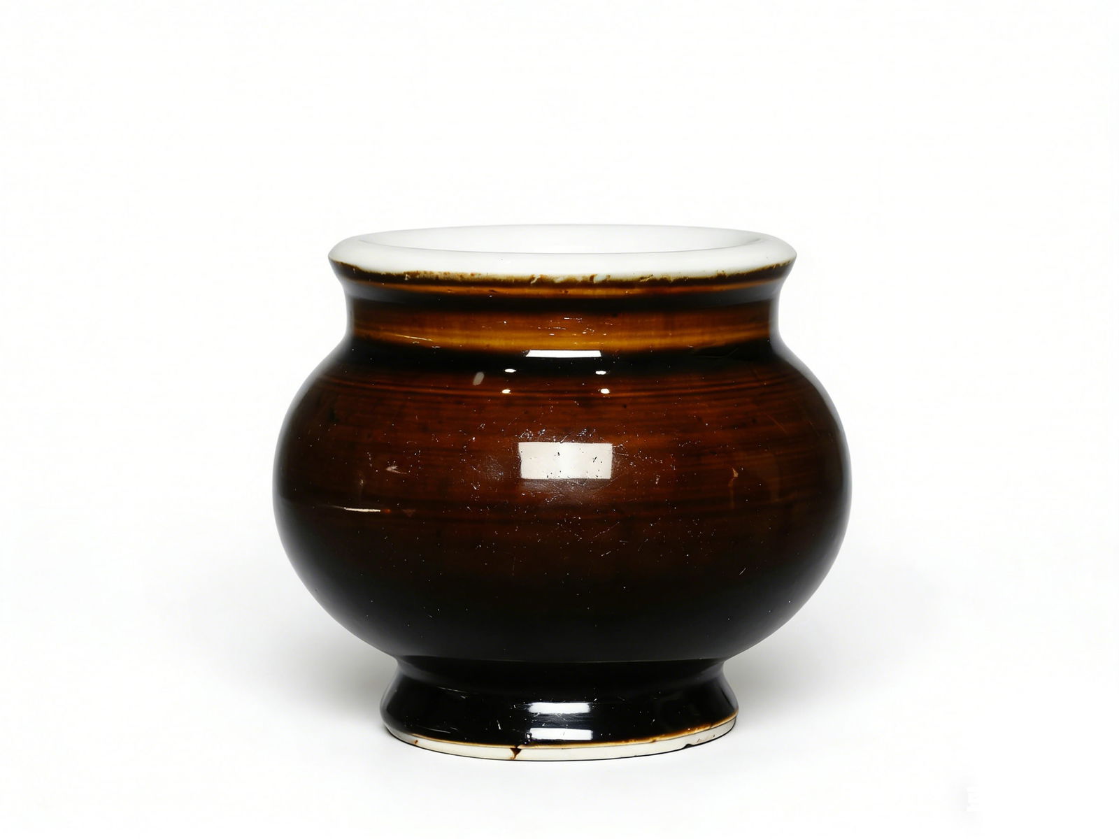 Qing Dynasty Soy-Sauce Glazed Jar with White Mouth: H:8cm W:9cm This is a Qing Dynasty soy-sauce glazed jar with a white mouth, a fine monochrome glaze daily-use decorative vessel. Made of solid ceramic, it is fully coated with deep, luminous