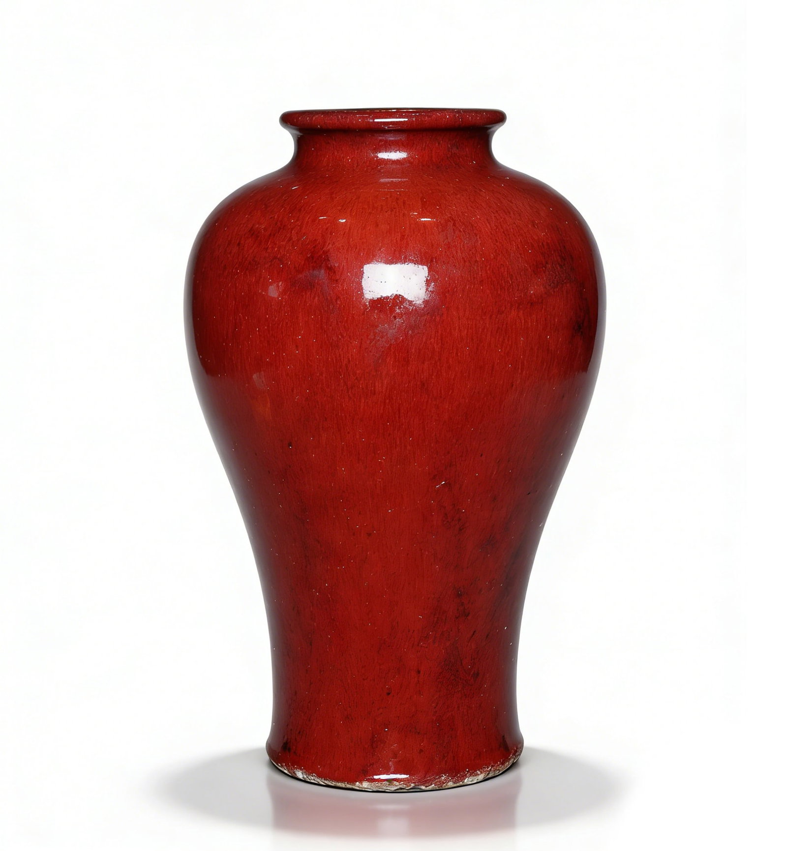 Qing Dynasty Langyao Red-Glazed Meiping Vase: H:33cmW:19cm This is a Qing Dynasty Langyao red-glazed meiping vase, a precious colored-glaze porcelain piece. Shaped as a classic meiping with a small mouth, short neck, full shoulder, and