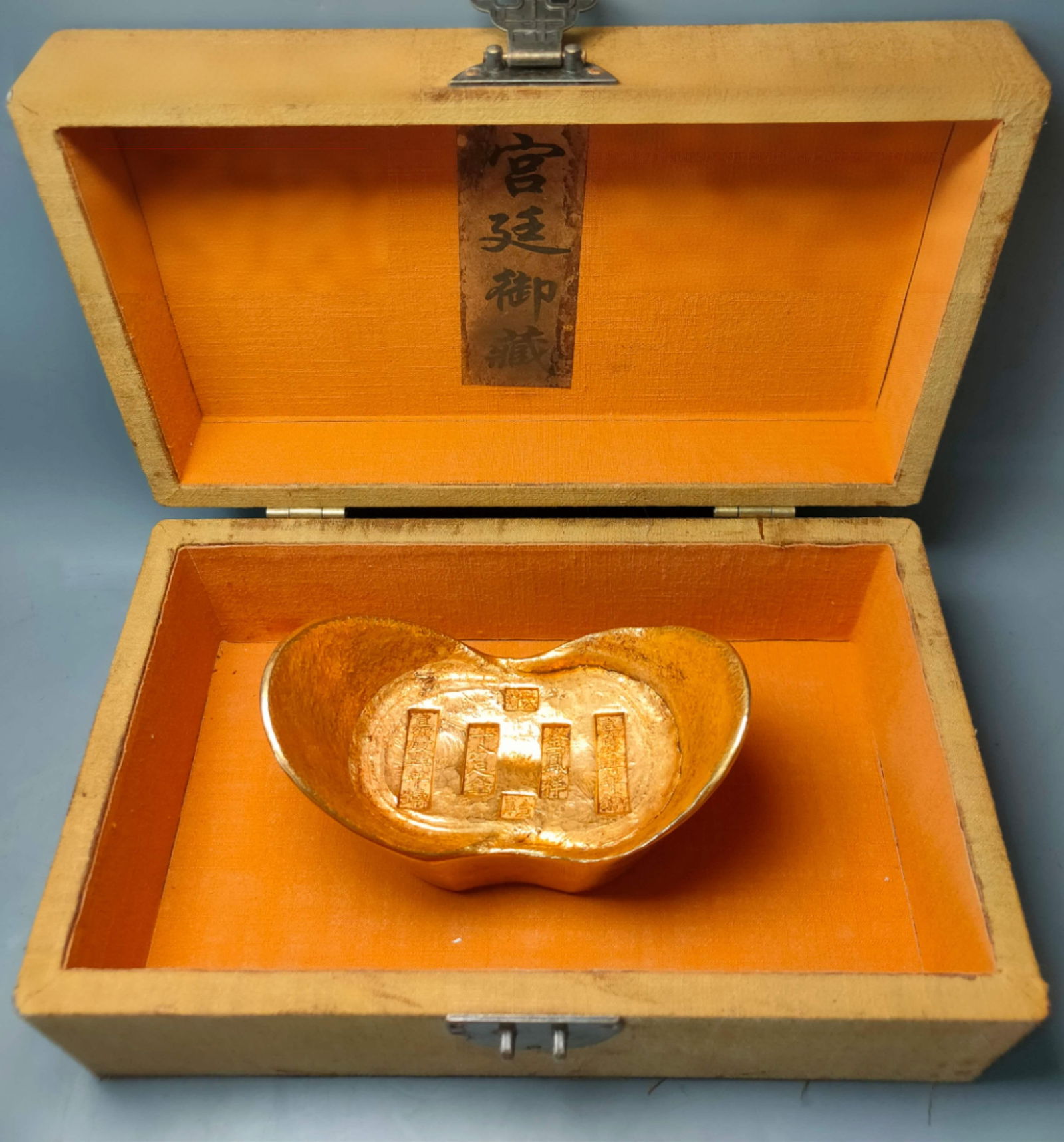 Old embroidered box containing gold ingots (1 of 9)