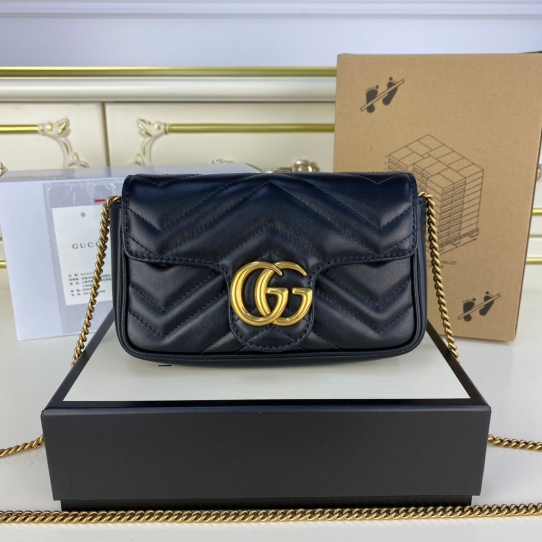GUCCI MARMONT Black Super Mini: The GUCCI Marmont Mini in black, a super mini GUCCI Nano, is tailor made for beauty. Featuring top quality hardware and supple leather, this GUCCI Marmont Mini is sure to turn heads. It can be worn cr
