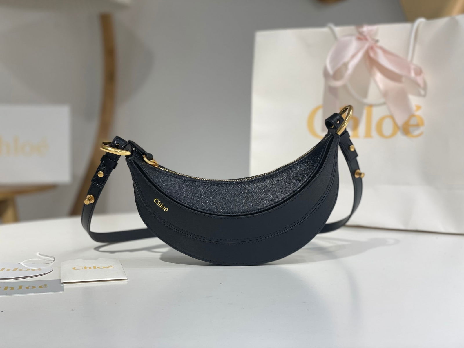 Chole: Chloe The Banana Bag is So Cool This BANANA calfskin shoulder/crossbody bag features a unique silhouette combined with a 3D textured effect, showcasing the brand's craftsmanship. It's playful and cute