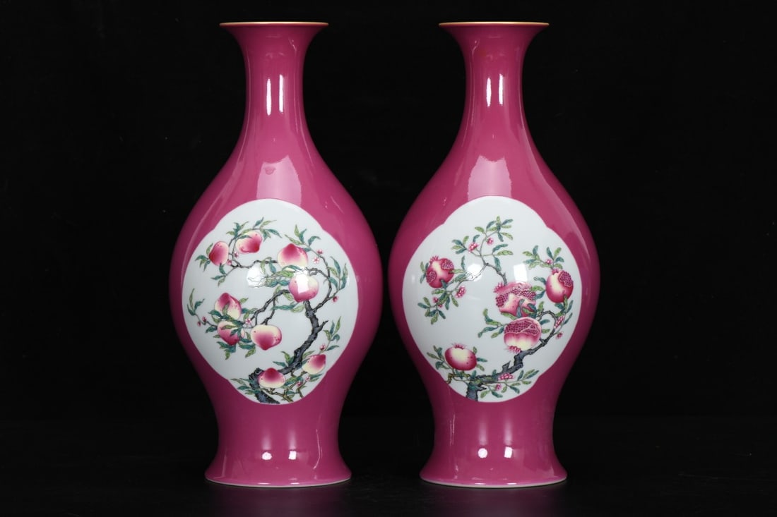 Qing Dynasty, Yongzheng Period: Enamel-painted Rouge-red Ground Vase with Windowed Fruit and: Qing Dynasty, Yongzheng Period: Enamel-painted rouge-red ground vase with openwork depicting melons and fruits, 36.8 cm high, 8.9 cm in mouth diameter, 17.2 cm in belly diameter, and 12 cm in base dia