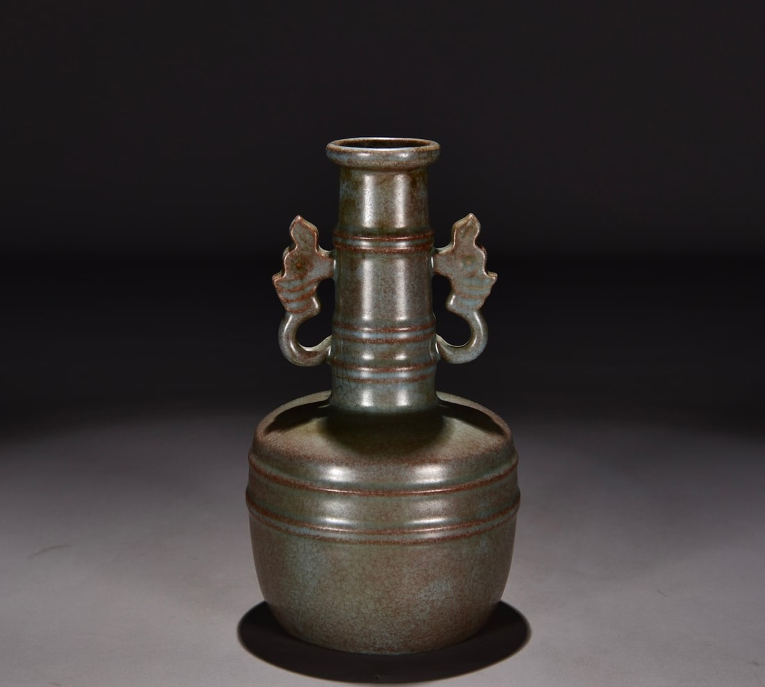 Formerly in the collection of a Song Dynasty Ru ware celadon-glazed double-eared vase with incised: A Song Dynasty Ru ware celadon vase with double handles and a design resembling a dragon pattern, formerly in my collection. Dimensions: Height 23 cm, Width 13 cm. Provenance:From an old private estat